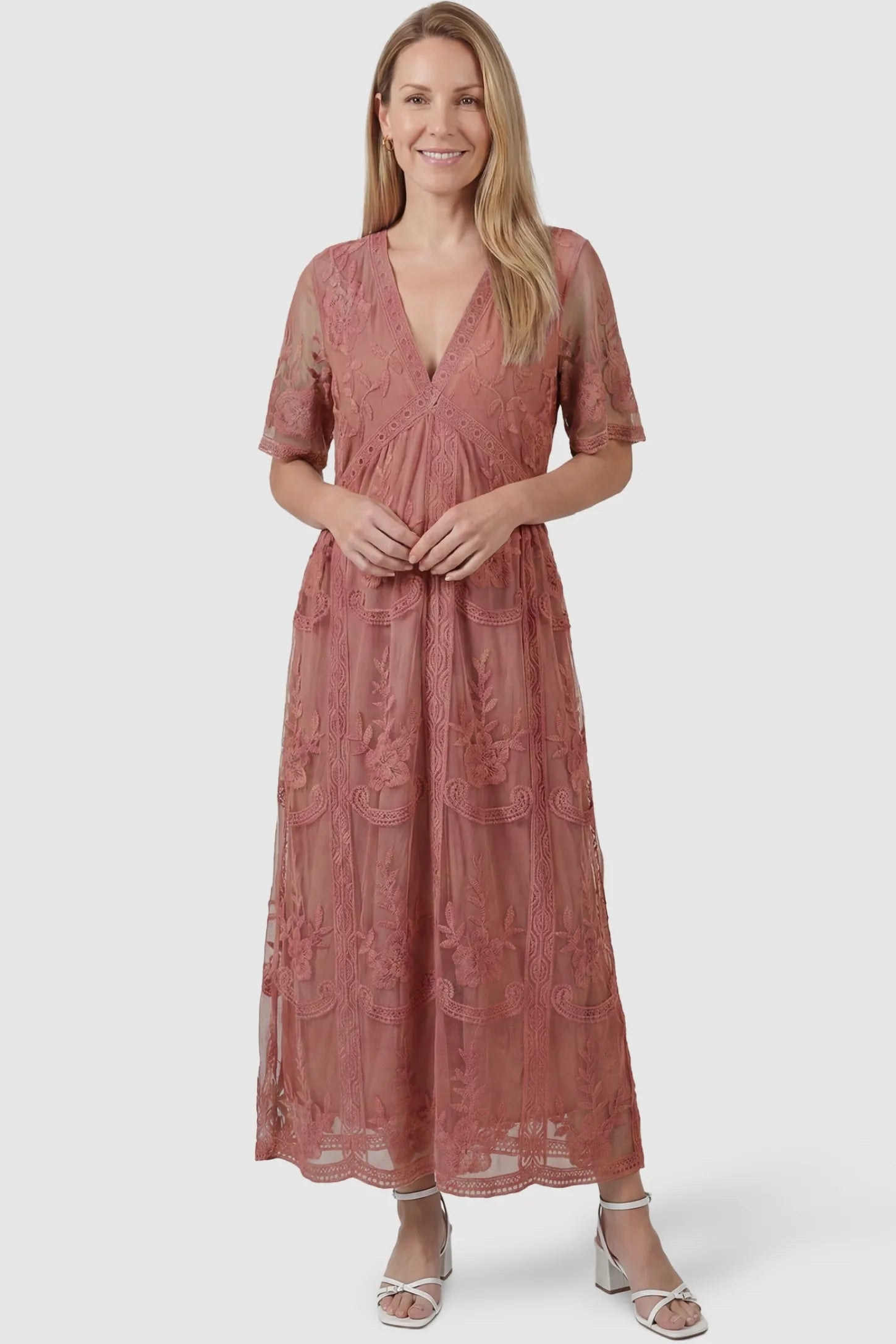 Lace Short Sheer Sleeve Maternity Maxi Dress Lace Short Sheer Sleeve Maternity Maxi Dress in pink featuring sheer embroidered sleeves on a non-pregnant model, postpartum view.