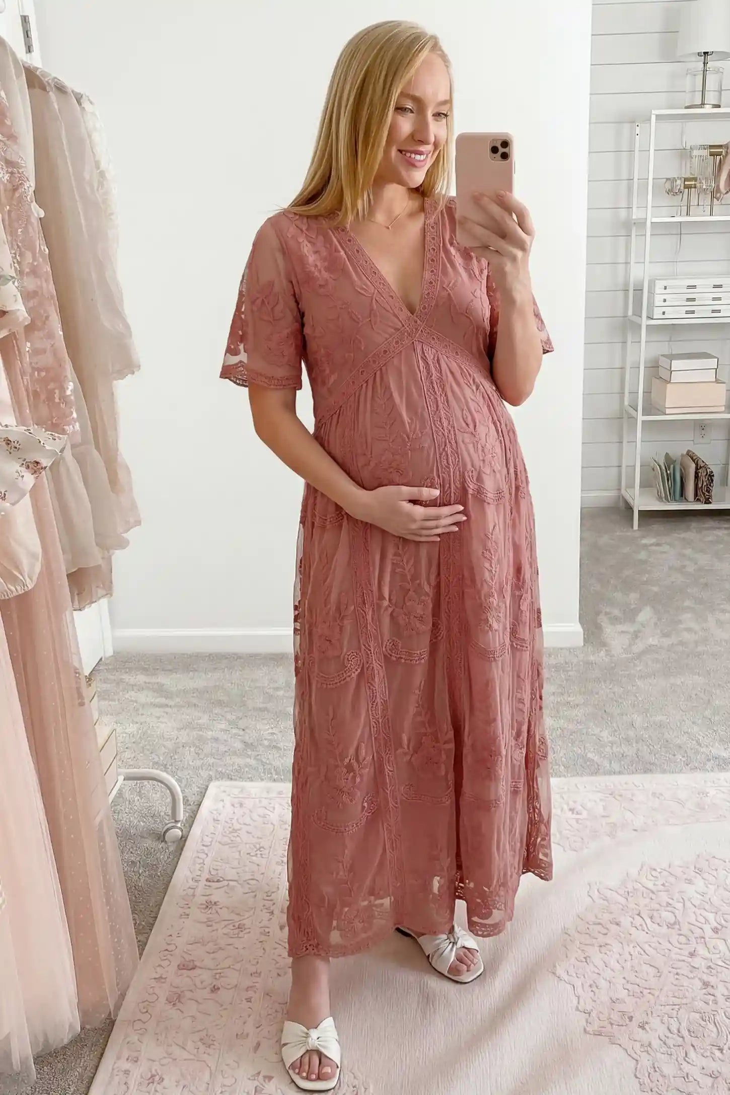 Lace Short Sheer Sleeve Maternity Maxi Dress Lace Short Sheer Sleeve Maternity Maxi Dress in pink featuring soft floral applique on a pregnant model, UGC view.