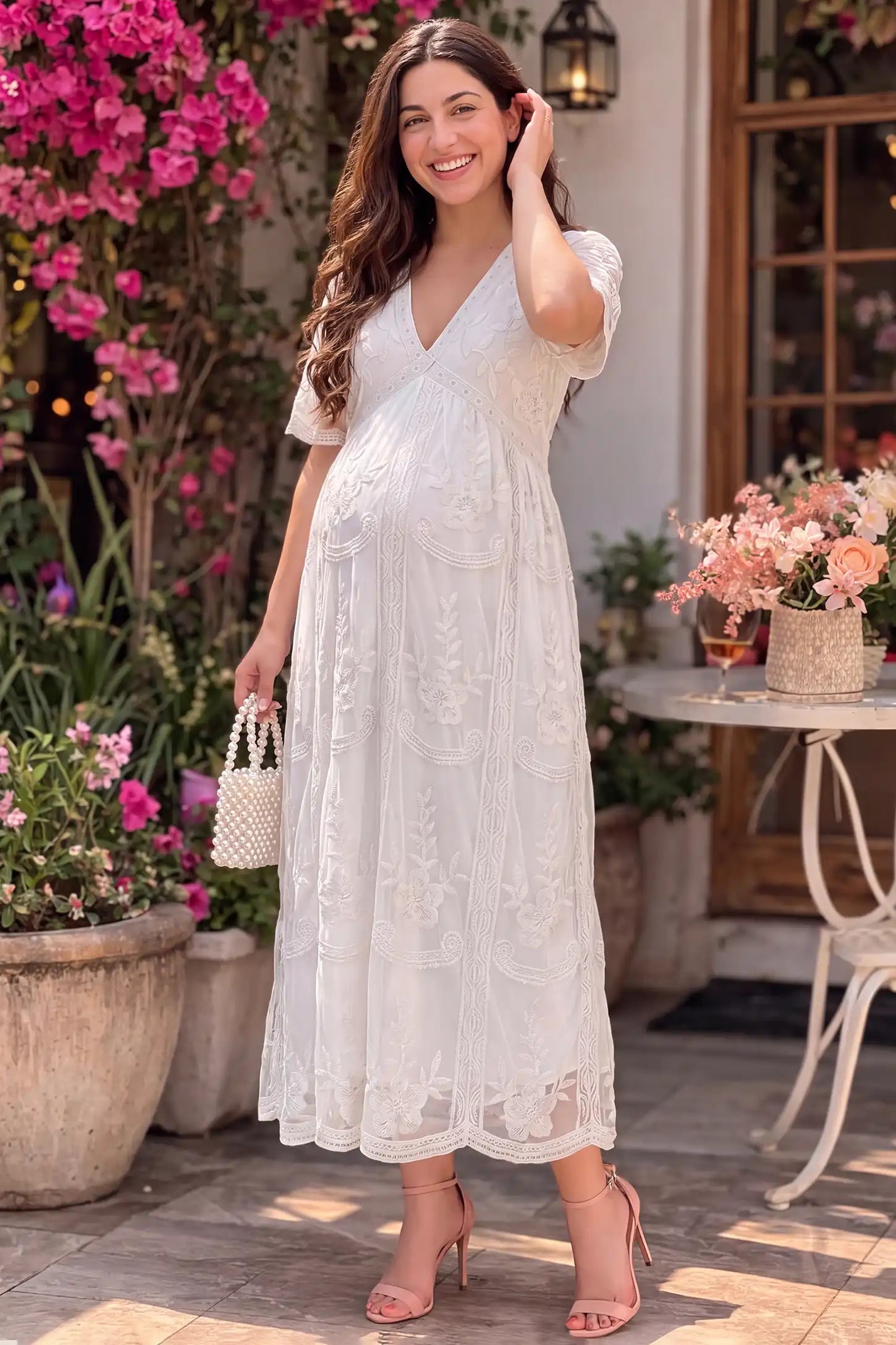 Lace Short Sheer Sleeve Maternity Maxi Dress Lace Short Sheer Sleeve Maternity Maxi Dress in white featuring embroidered sheer sleeves on plus a pregnant model, front view.