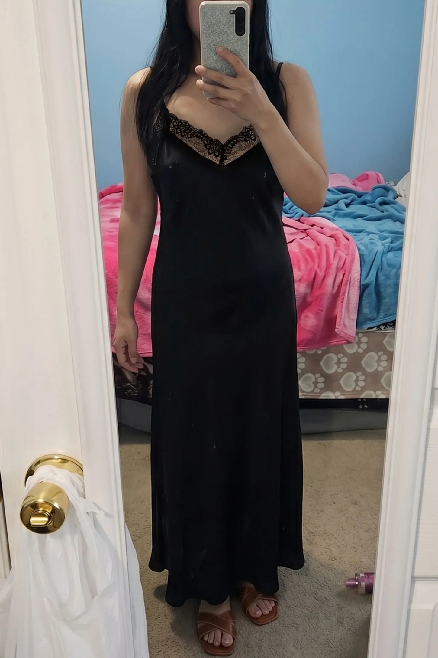 Lace-Trim Maternity Slip Dress Lace-Trim Maternity Slip Dress in Black featuring sleek spaghetti straps on a pregnant model, mirror selfie view.