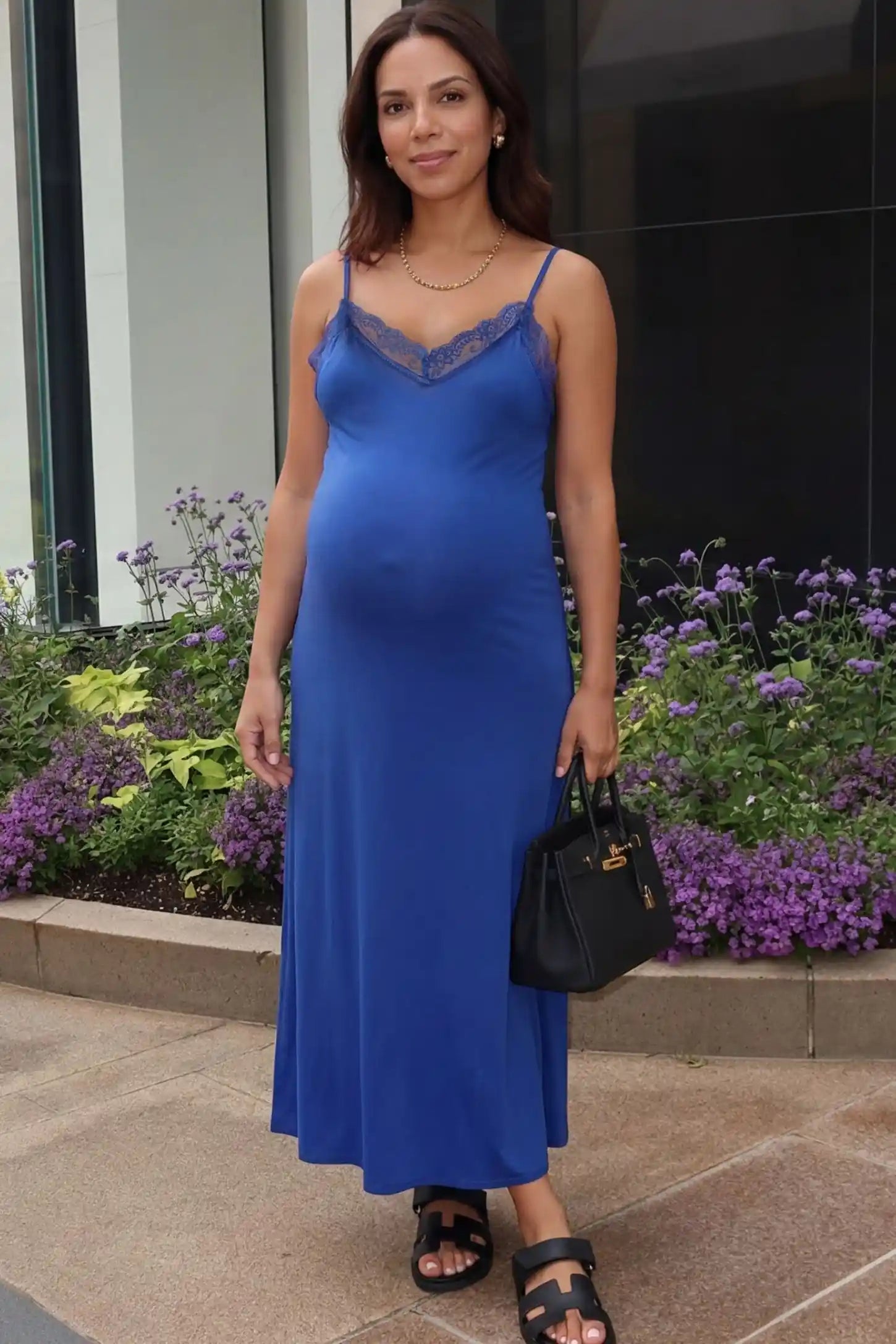 Lace-Trim Maternity Slip Dress Lace-Trim Maternity Slip Dress in Blue featuring delicate spaghetti straps on a pregnant model, front view.