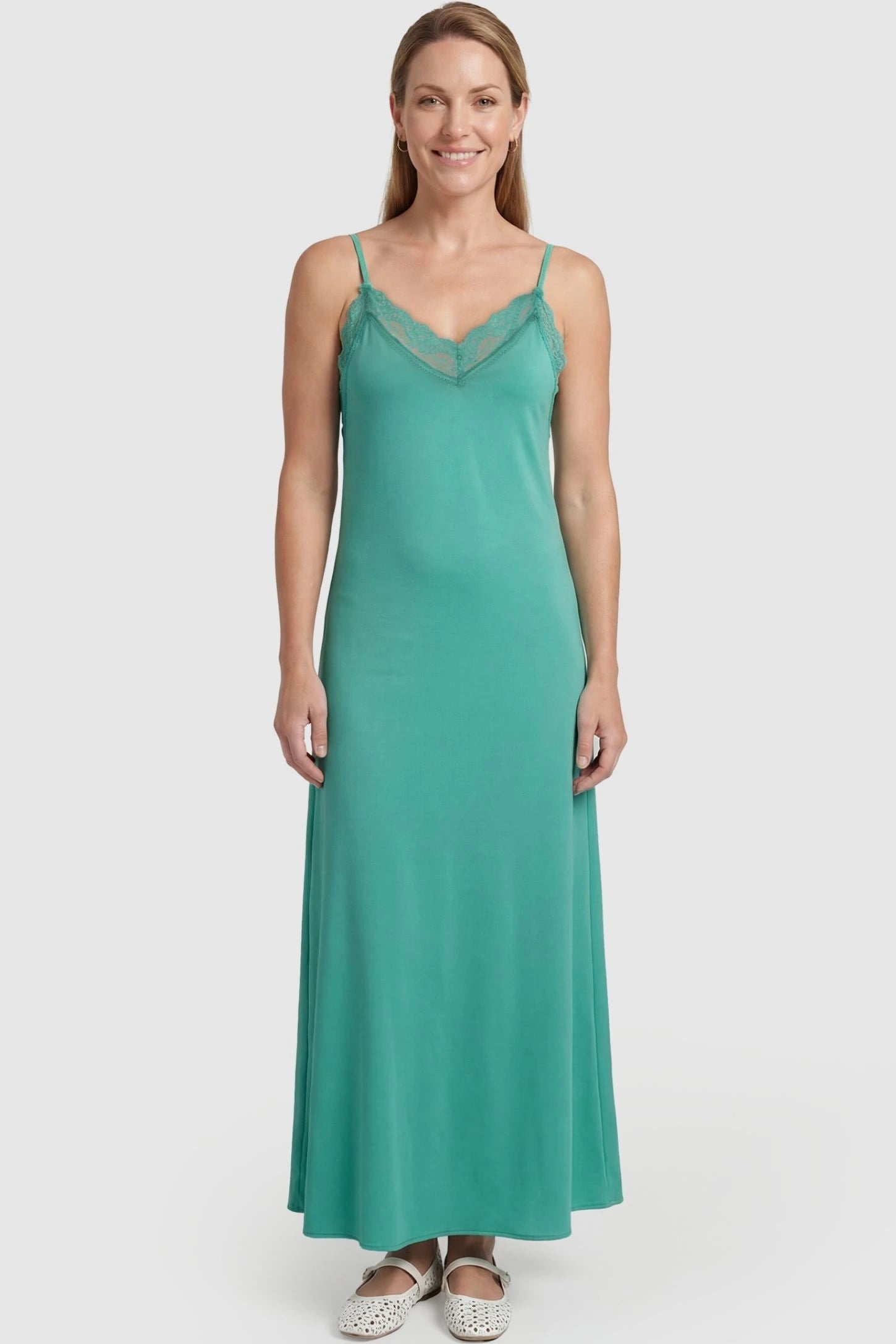 Lace-Trim Maternity Slip Dress Lace-Trim Maternity Slip Dress in Green featuring delicate spaghetti straps on a non-pregnant model, front view.
