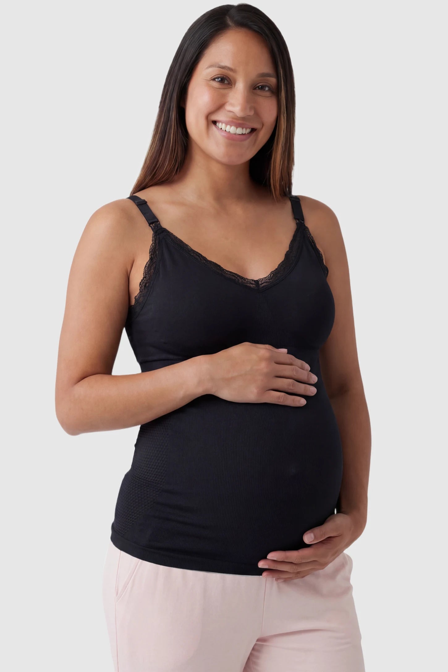 Lace Trim Wire Free Maternity Nursing Camisole Lace Trim Wire Free Maternity Nursing Camisole in black offering one-handed nursing access on a pregnant model, front view.