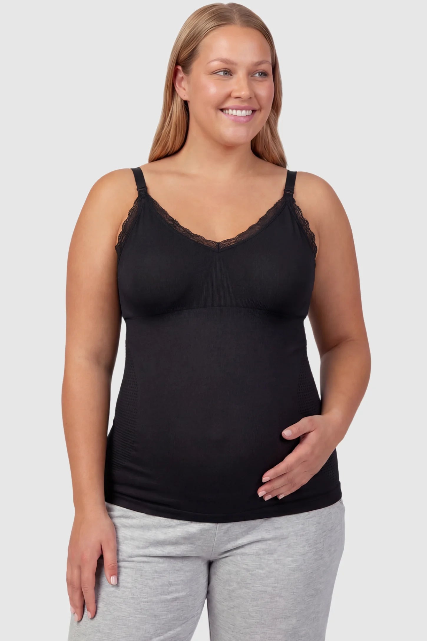 Lace Trim Wire Free Maternity Nursing Camisole Lace Trim Wire Free Maternity Nursing Camisole in black offering one-handed nursing access on a plus size pregnant model, front view.