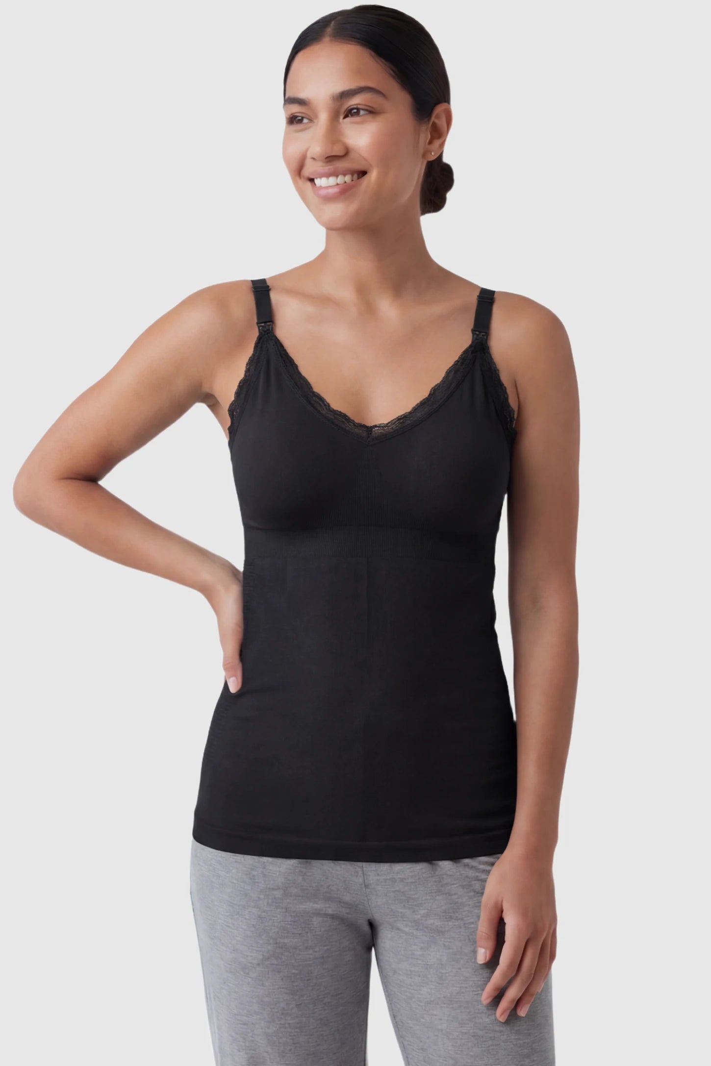 Lace Trim Wire Free Maternity Nursing Camisole Lace Trim Wire Free Maternity Nursing Camisole in black offering one-handed nursing access on a postpartum model, front view.