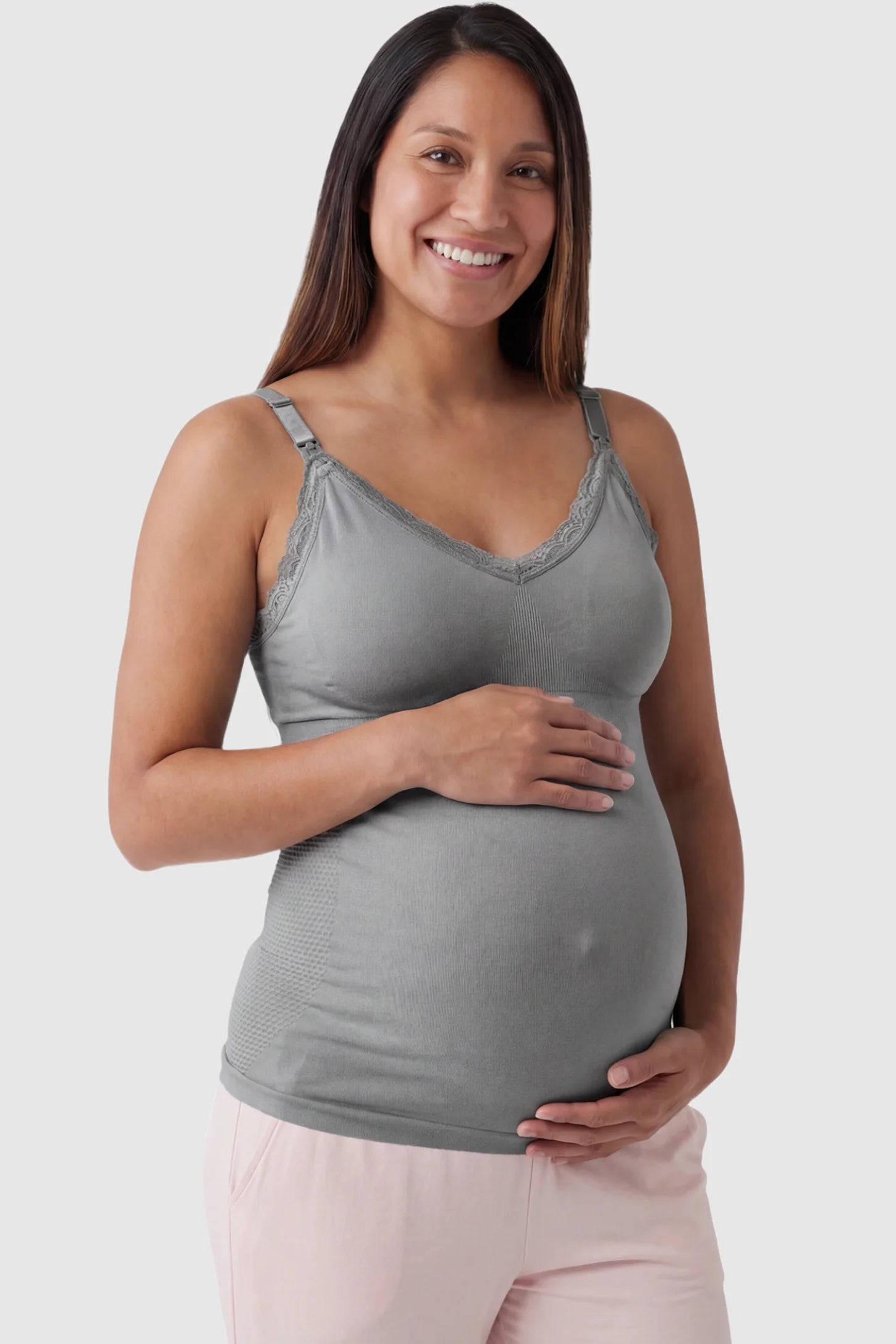 Lace Trim Wire Free Maternity Nursing Camisole Lace Trim Wire Free Maternity Nursing Camisole in gray offering one-handed nursing access on a pregnant model, front view.