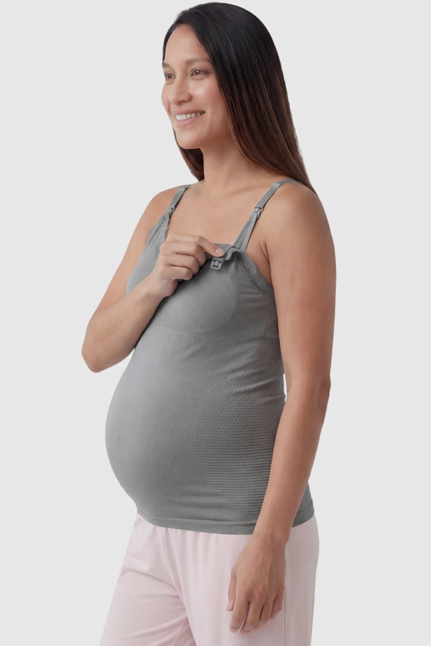Lace Trim Wire Free Maternity Nursing Camisole Lace Trim Wire Free Maternity Nursing Camisole in gray offering one-handed nursing access on a pregnant model, side view.