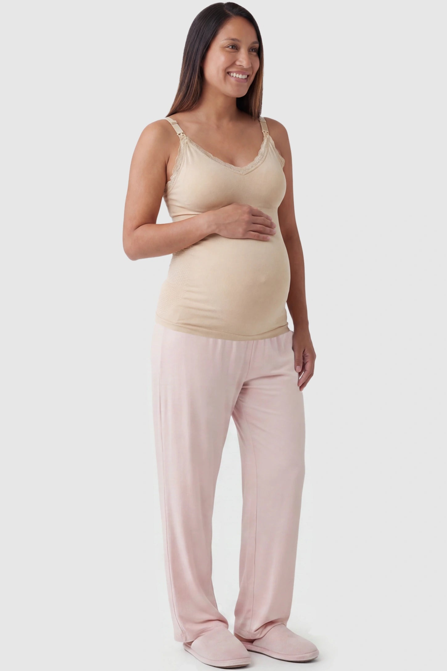 Lace Trim Wire Free Maternity Nursing Camisole Lace Trim Wire Free Maternity Nursing Camisole in skin tone offering one-handed nursing access on a pregnant model, full body view.