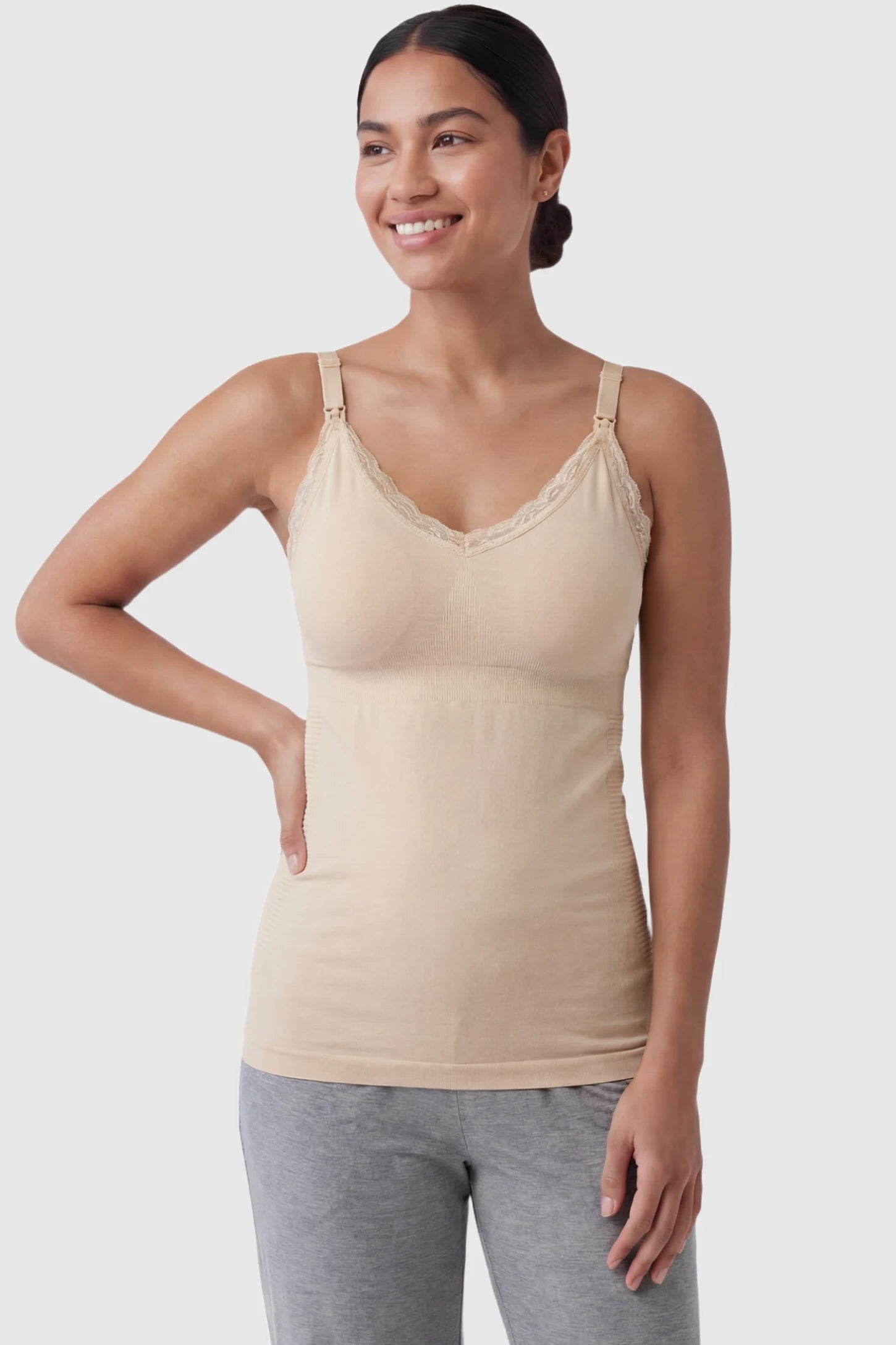 Lace Trim Wire Free Maternity Nursing Camisole Lace Trim Wire Free Maternity Nursing Camisole in skin tone offering one-handed nursing access on a postpartum model, front view.