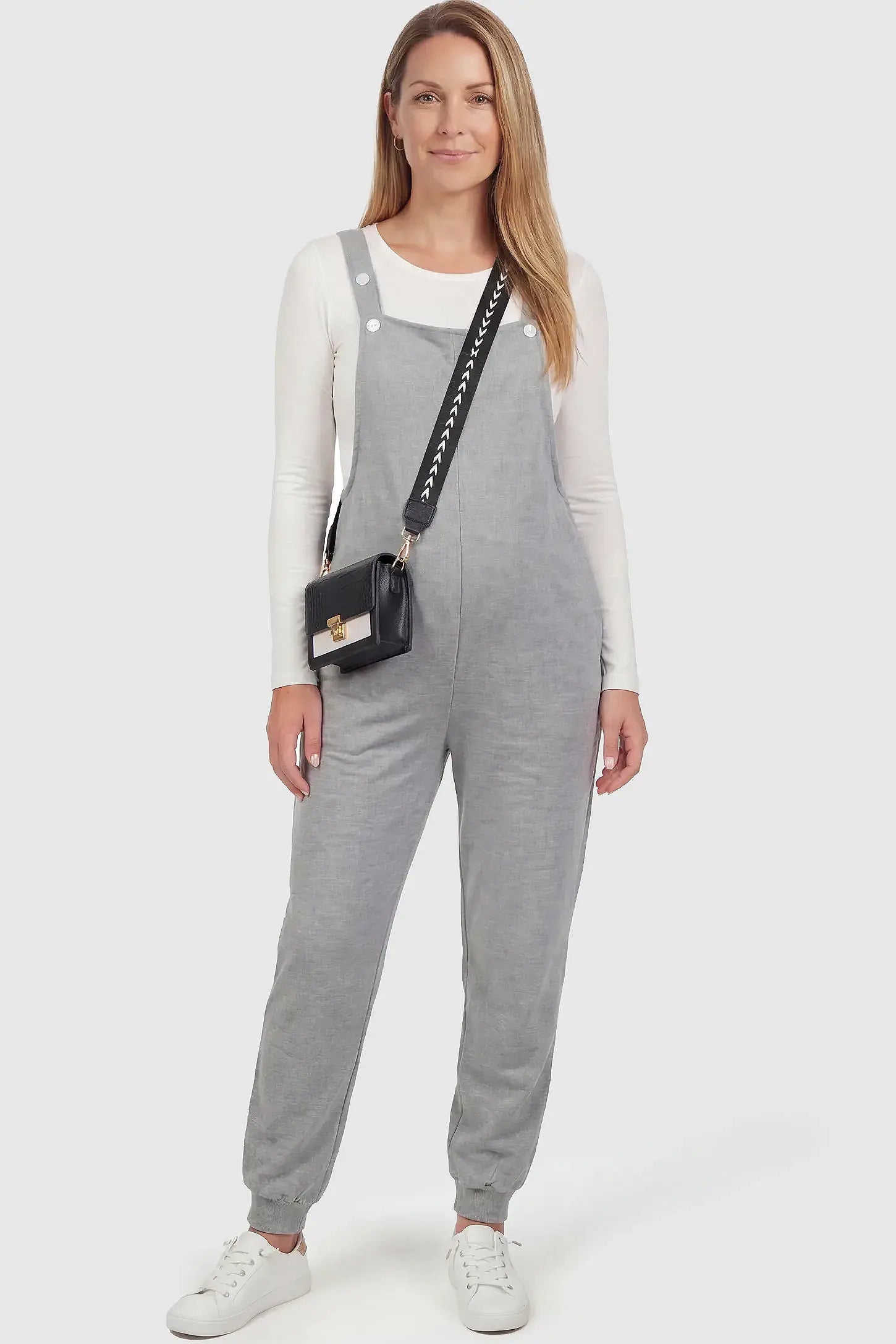 Square Neck Pocketed Maternity Jogger Jumpsuit Sleeveless Square Neck Maternity Jogger Jumpsuit in Gray Jersey Knit with deep side pockets on a non pregnant model.