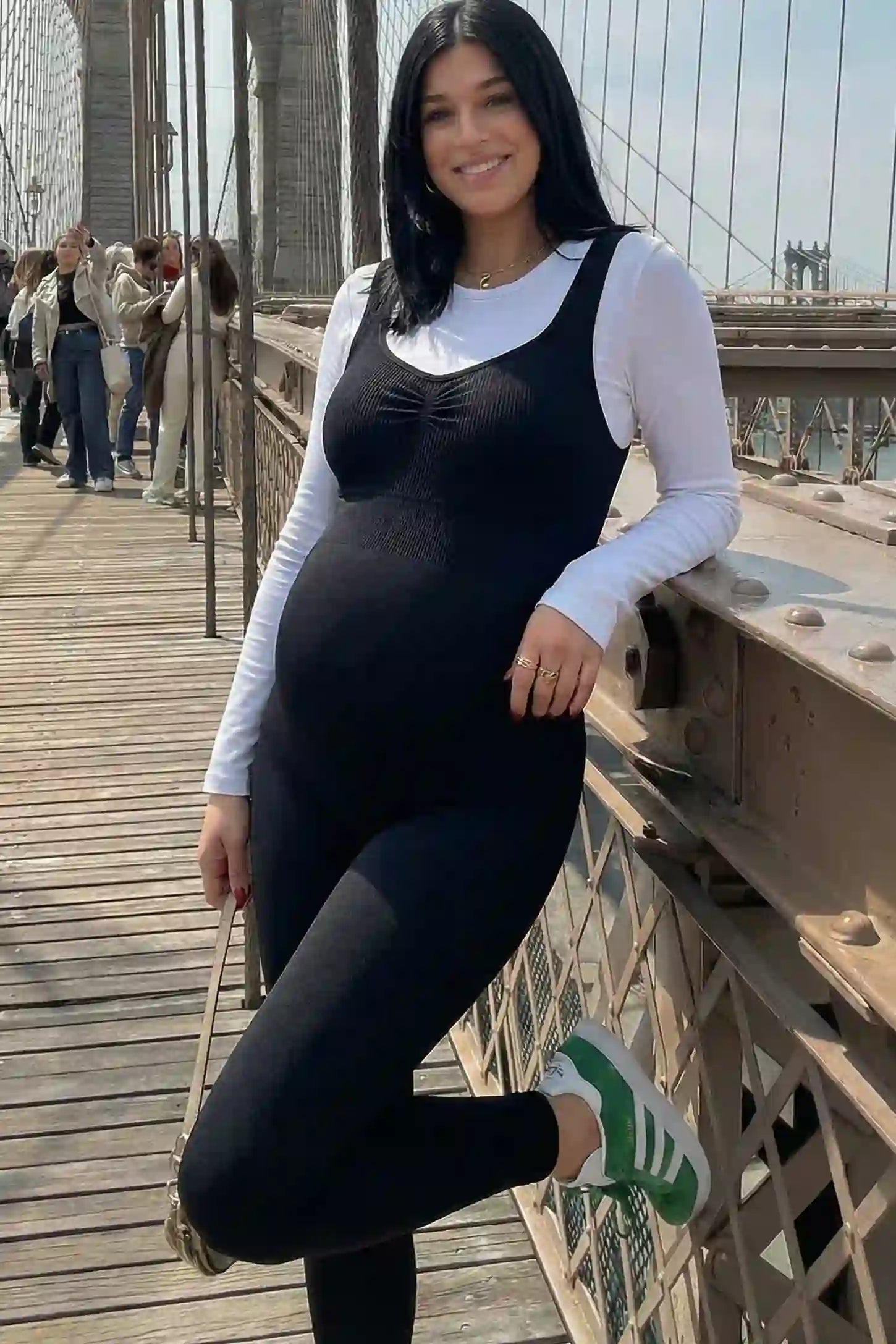 Scoop Neck Sleeveless Ribbed Bodycon Maternity Jumpsuit Scoop Neck Sleeveless Ribbed Bodycon Maternity Jumpsuit in Black featuring a seamless stretch fit on a pregnant model.