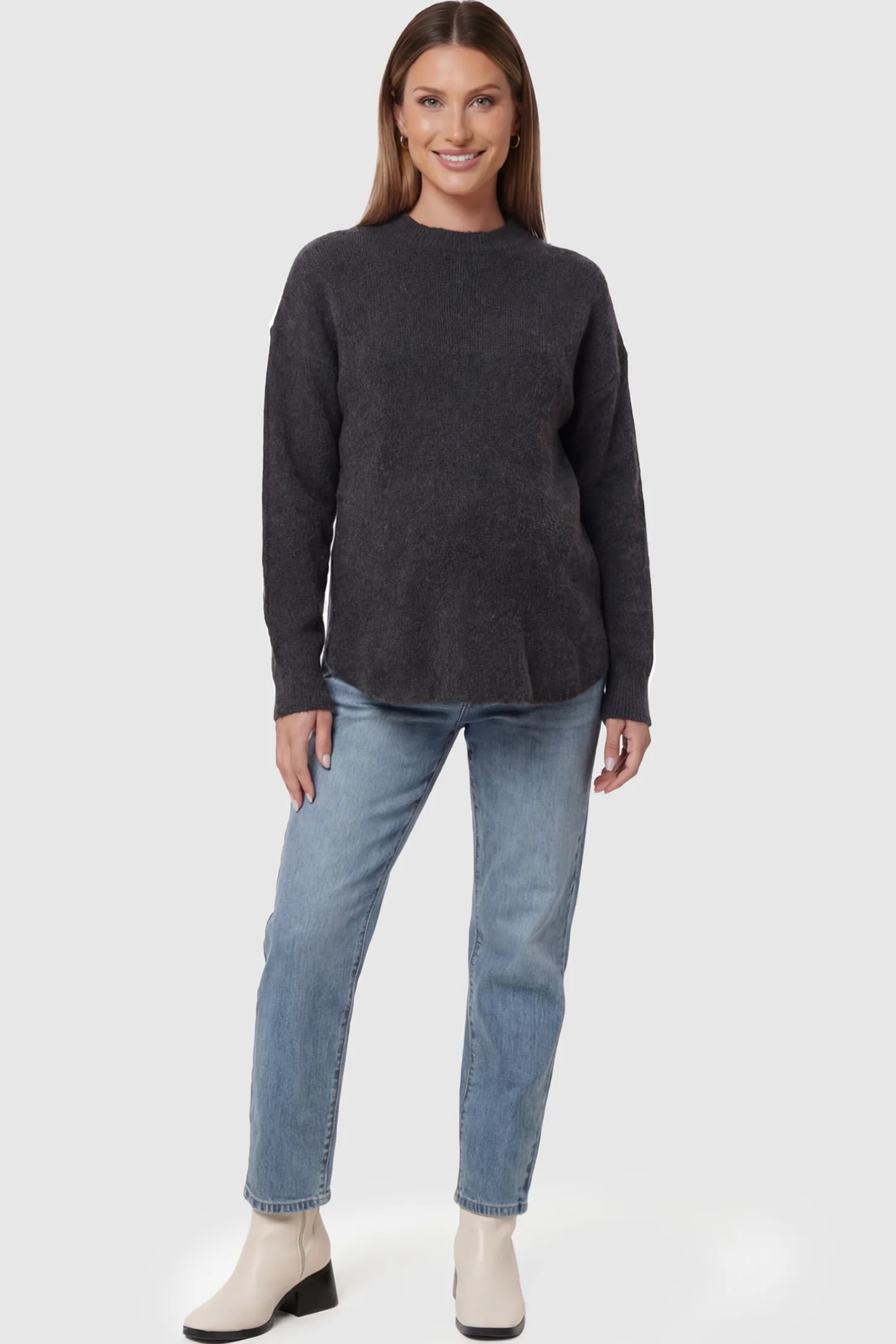 Mock Neck Long Sleeve Maternity Sweater Mock Neck Long Sleeve Maternity Sweater in Black thickened woolen fabric on a pregnant model posing front.