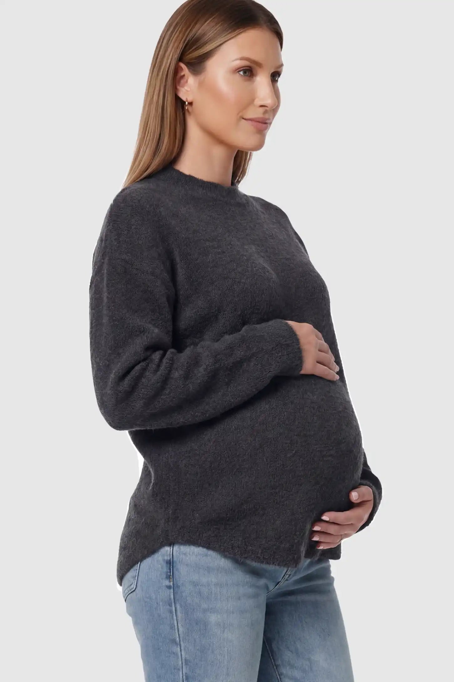 Mock Neck Long Sleeve Maternity Sweater Mock Neck Long Sleeve Maternity Sweater in Black thickened woolen fabric on a pregnant model showing side.