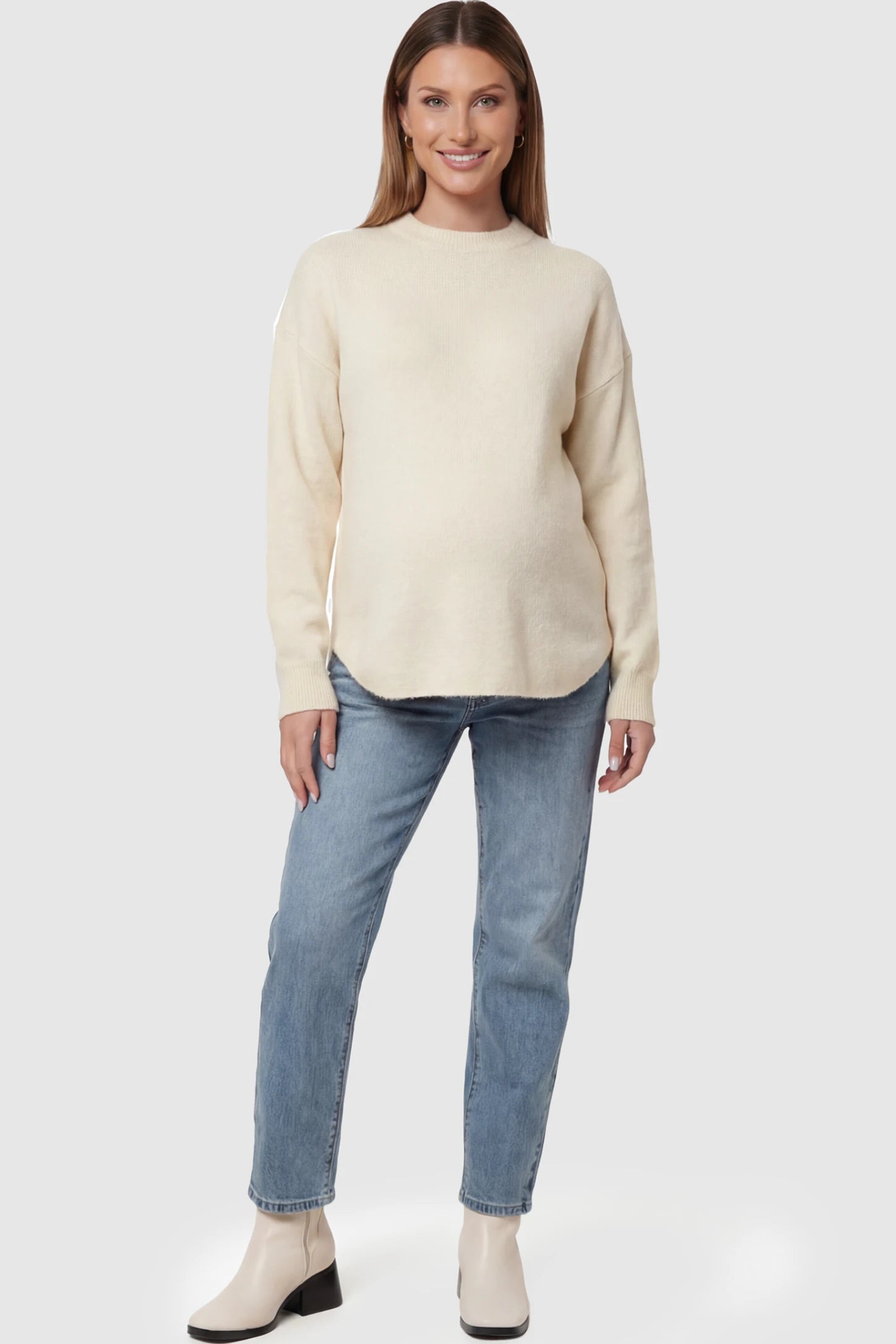 Mock Neck Long Sleeve Maternity Sweater Mock Neck Long Sleeve Maternity Sweater in White thickened woolen fabric on a pregnant model posing front.