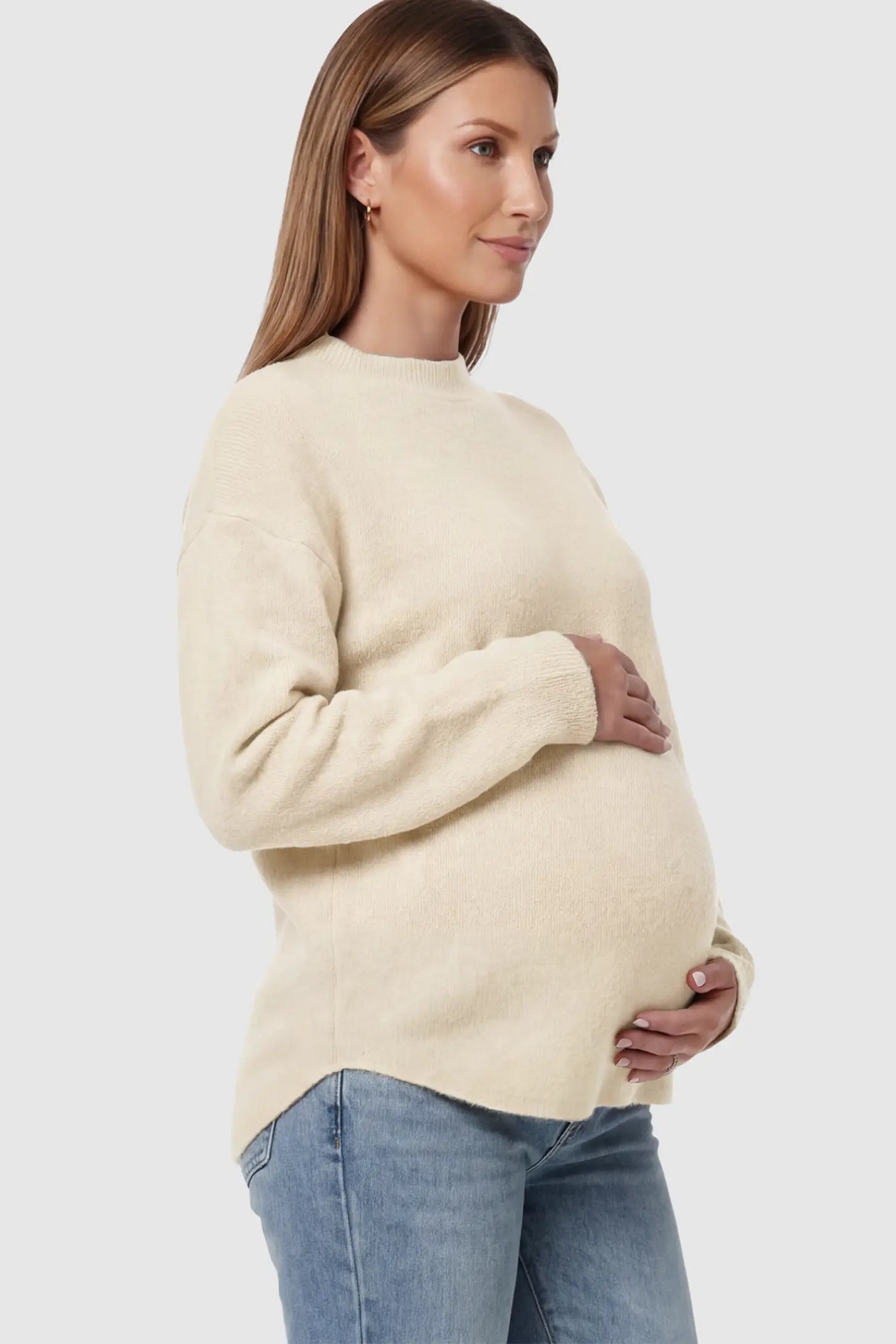Mock Neck Long Sleeve Maternity Sweater Mock Neck Long Sleeve Maternity Sweater in White thickened woolen fabric on a pregnant model showing side.