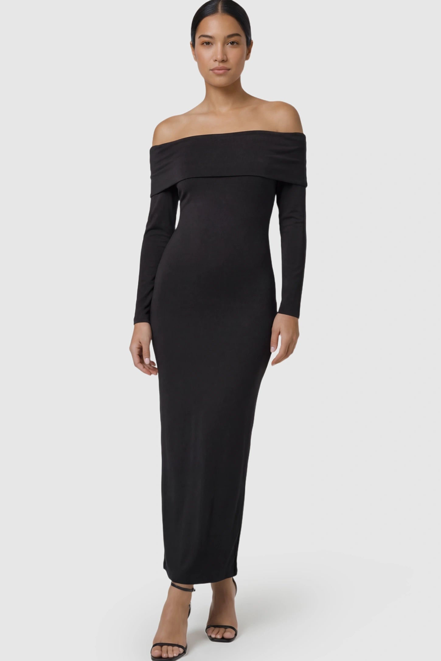 Solid Off Shoulder Bodycon Maternity Maxi Dress Off Shoulder Bodycon Maternity Maxi Dress in Black featuring a smooth stretch finish on a postpartum model.