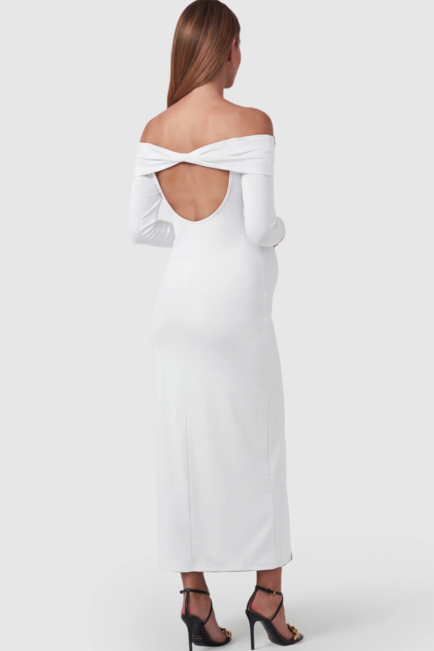 Solid Off Shoulder Bodycon Maternity Maxi Dress Off Shoulder Bodycon Maternity Maxi Dress in White featuring a back cutout on a pregnant model.