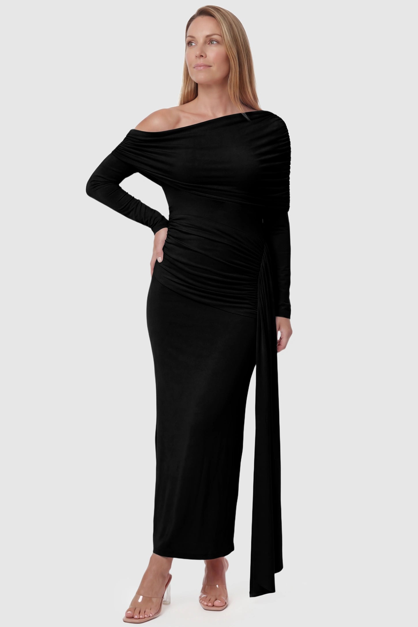 Off Shoulder Draped Wrap Bodycon Maternity Maxi Dress Off Shoulder Draped Wrap Bodycon Maternity Maxi Dress in Black featuring side ruching and long sleeves on a postpartum model, front view.