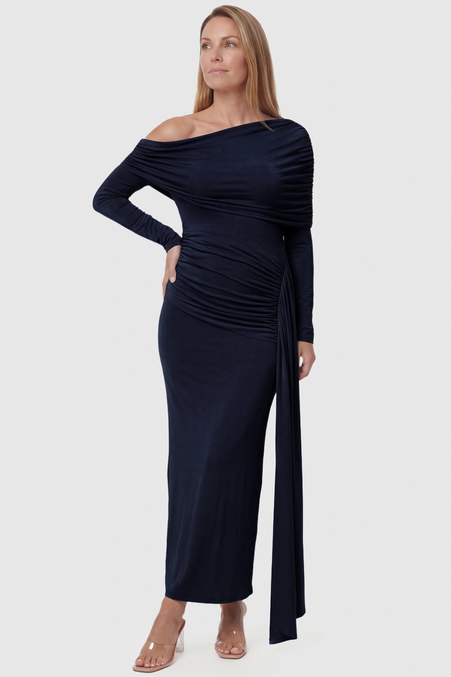 Off Shoulder Draped Wrap Bodycon Maternity Maxi Dress Off Shoulder Draped Wrap Bodycon Maternity Maxi Dress in Navy Blue featuring side ruching and long sleeves on a postpartum model, front view.