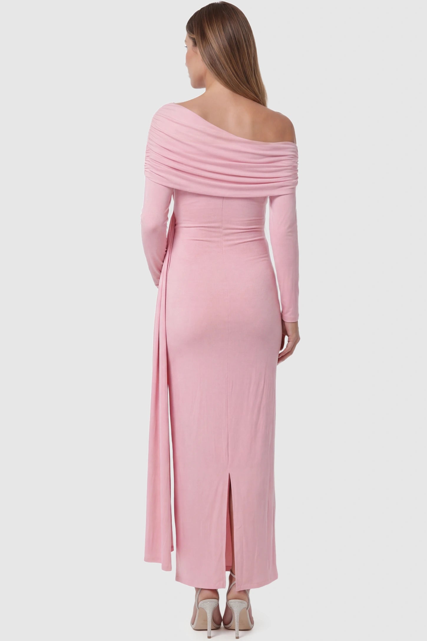 Off Shoulder Draped Wrap Bodycon Maternity Maxi Dress Off Shoulder Draped Wrap Bodycon Maternity Maxi Dress in Pink featuring side ruching and long sleeves on a pregnant model back view.