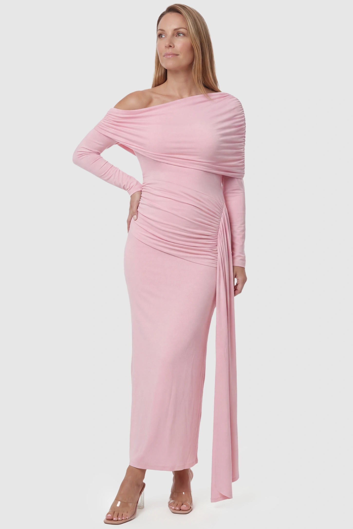 Off Shoulder Draped Wrap Bodycon Maternity Maxi Dress Off Shoulder Draped Wrap Bodycon Maternity Maxi Dress in Pink featuring side ruching and long sleeves on a postpartum model, front view.