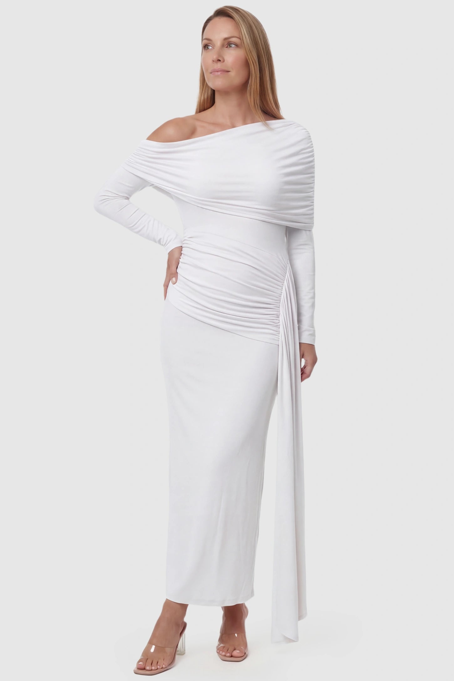 Off Shoulder Draped Wrap Bodycon Maternity Maxi Dress Off Shoulder Draped Wrap Bodycon Maternity Maxi Dress in White featuring side ruching and long sleeves on a postpartum model, front view.
