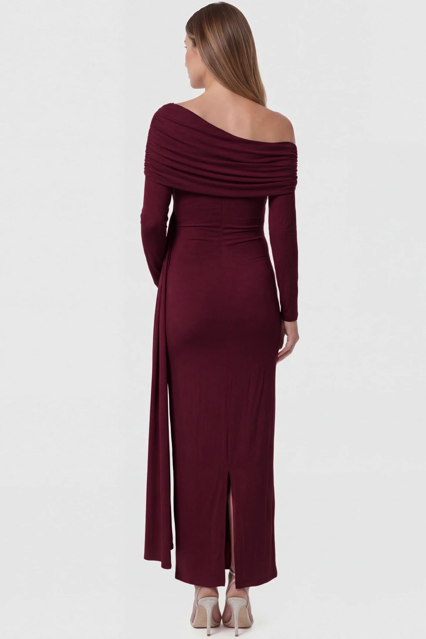 Off Shoulder Draped Wrap Bodycon Maternity Maxi Dress Off Shoulder Draped Wrap Bodycon Maternity Maxi Dress in Wine Red featuring side ruching and long sleeves on a pregnant model back view.