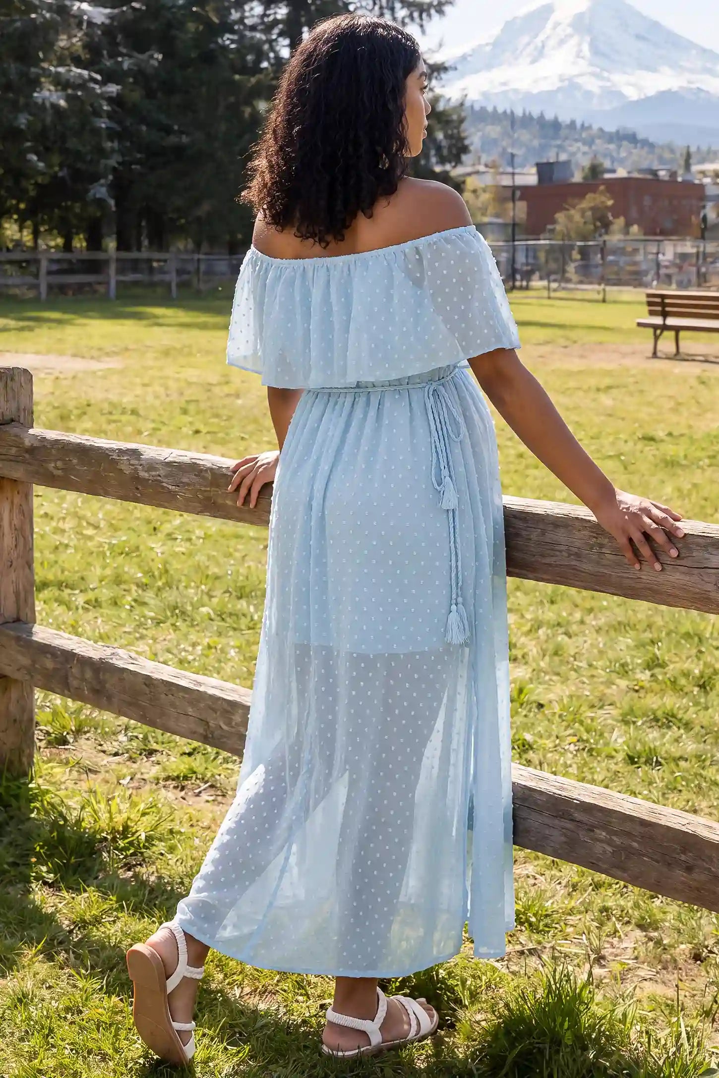 Off Shoulder Elastic Waist A-Line Maternity Maxi Dress Off Shoulder Elastic Waist A-Line Maternity Maxi Dress in Baby Blue showing the back detail on a pregnant model, lifestyle back view.