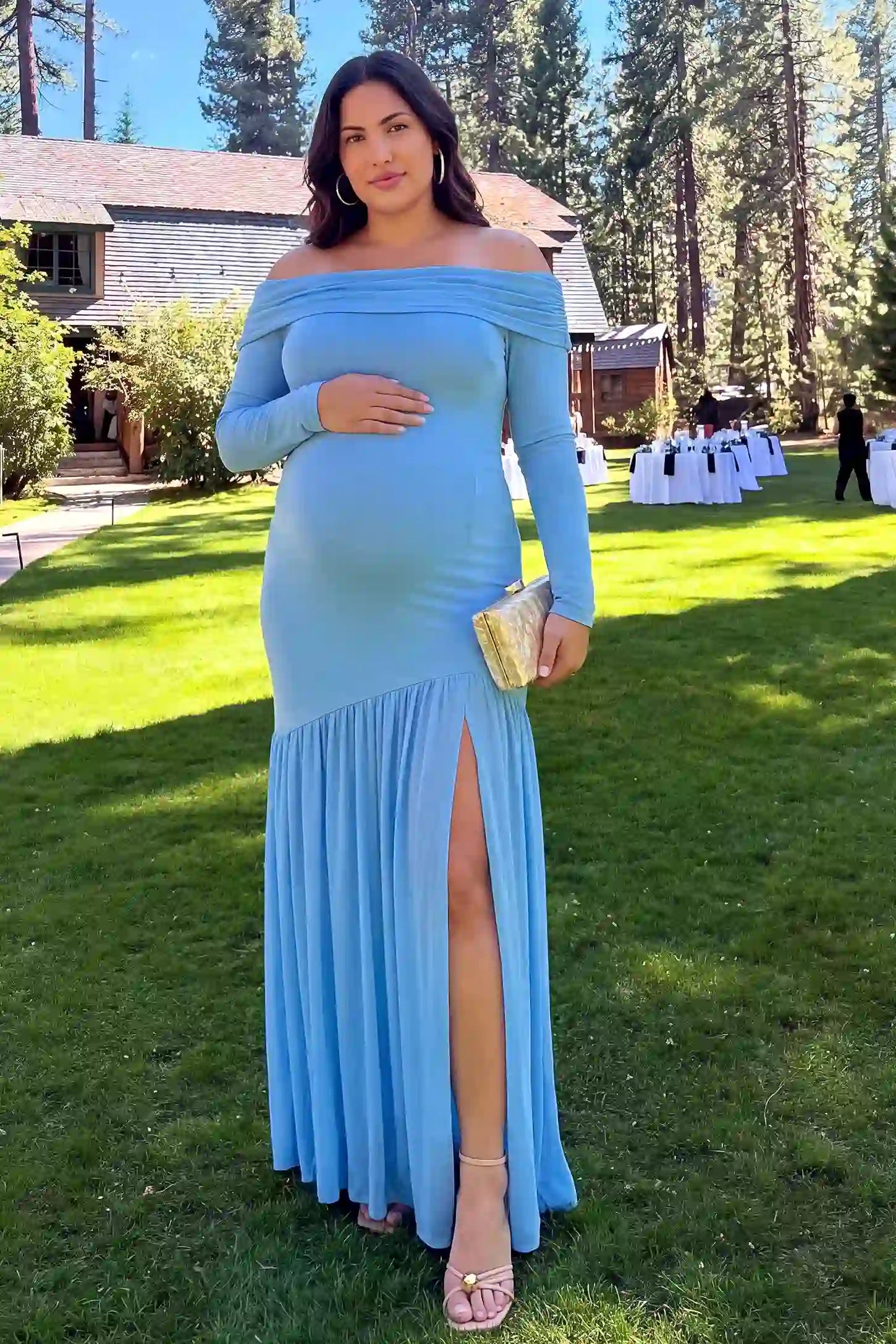 Off Shoulder Long Sleeve Split Maternity Maxi Dress Off Shoulder Long Sleeve Split Maternity Maxi Dress in Baby Blue featuring a flattering stretchy fit, lifestyle view on a plus-size model.