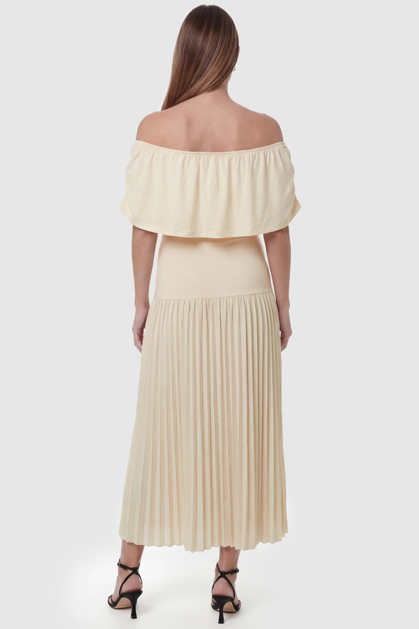 Pleated Off Shoulder Maternity Maxi Dress Pleated Off Shoulder Maternity Maxi Dress  in Beige featuring a high stretch pleated maxi skirt on a pregnant model, back view.