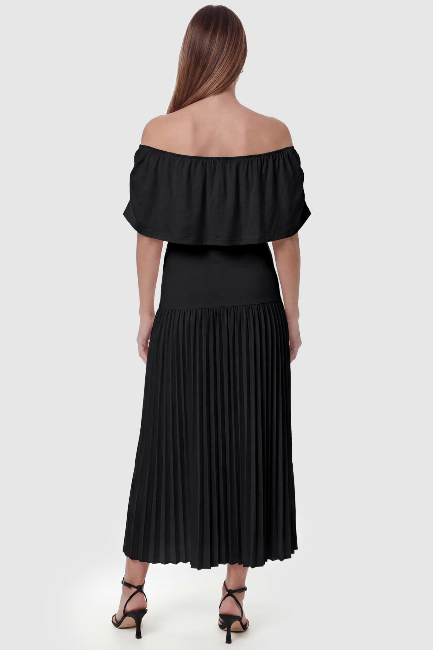 Pleated Off Shoulder Maternity Maxi Dress Pleated Off Shoulder Maternity Maxi Dress  in Black featuring a high stretch pleated maxi skirt on a pregnant model, back view.