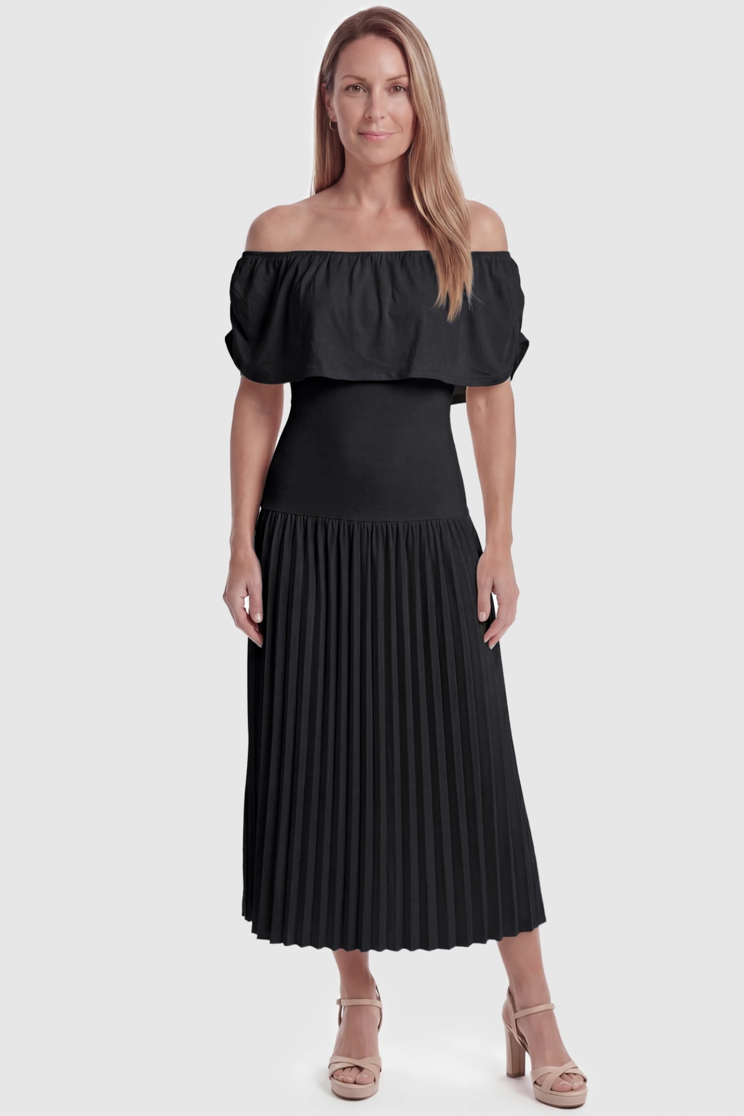 Pleated Off Shoulder Maternity Maxi Dress Pleated Off Shoulder Maternity Maxi Dress  in Black featuring a high stretch pleated maxi skirt on a postpartum model, front view.