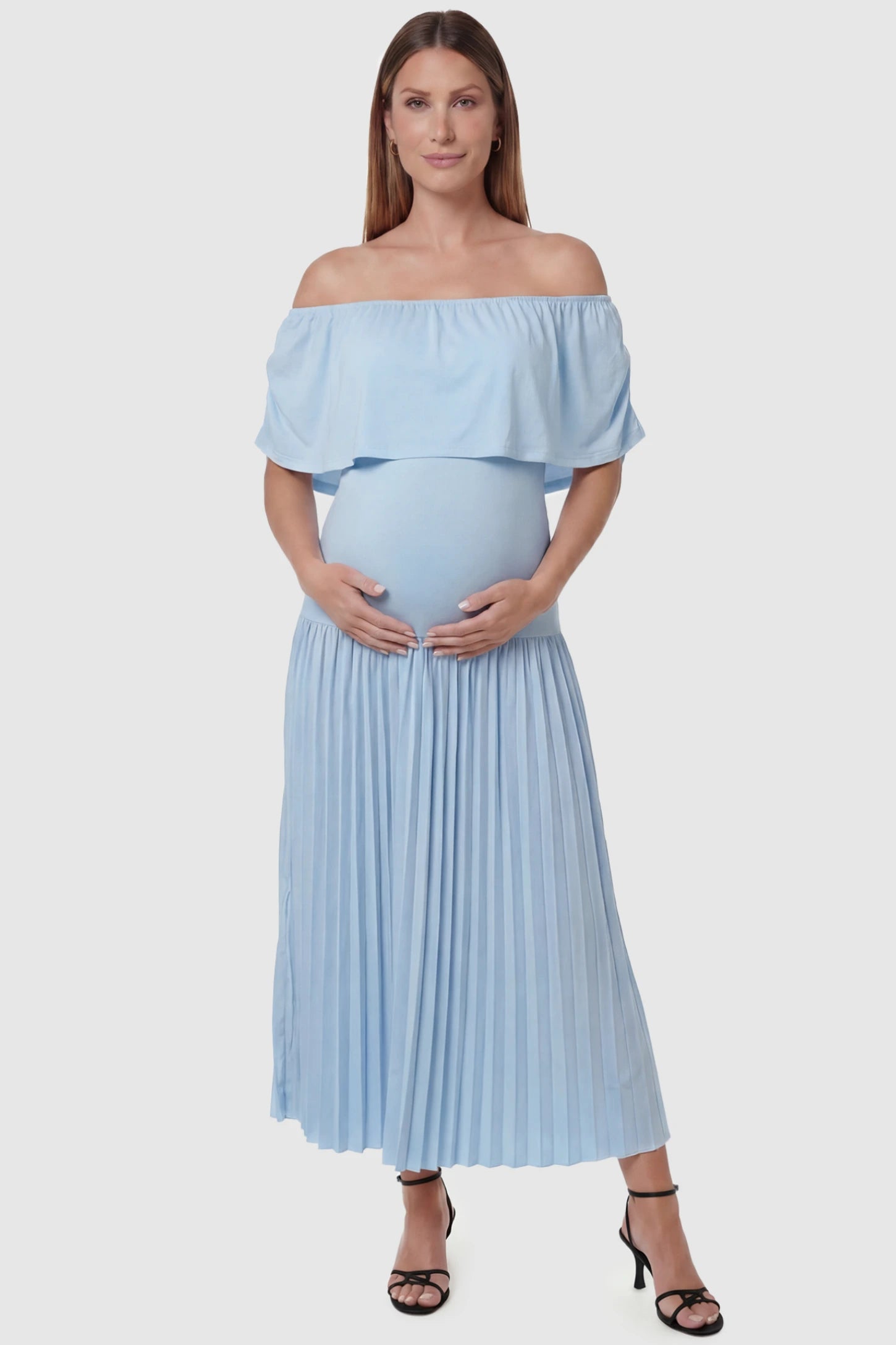 Pleated Off Shoulder Maternity Maxi Dress Pleated Off Shoulder Maternity Maxi Dress  in Light Blue featuring a high stretch pleated maxi skirt on a pregnant model, front view.