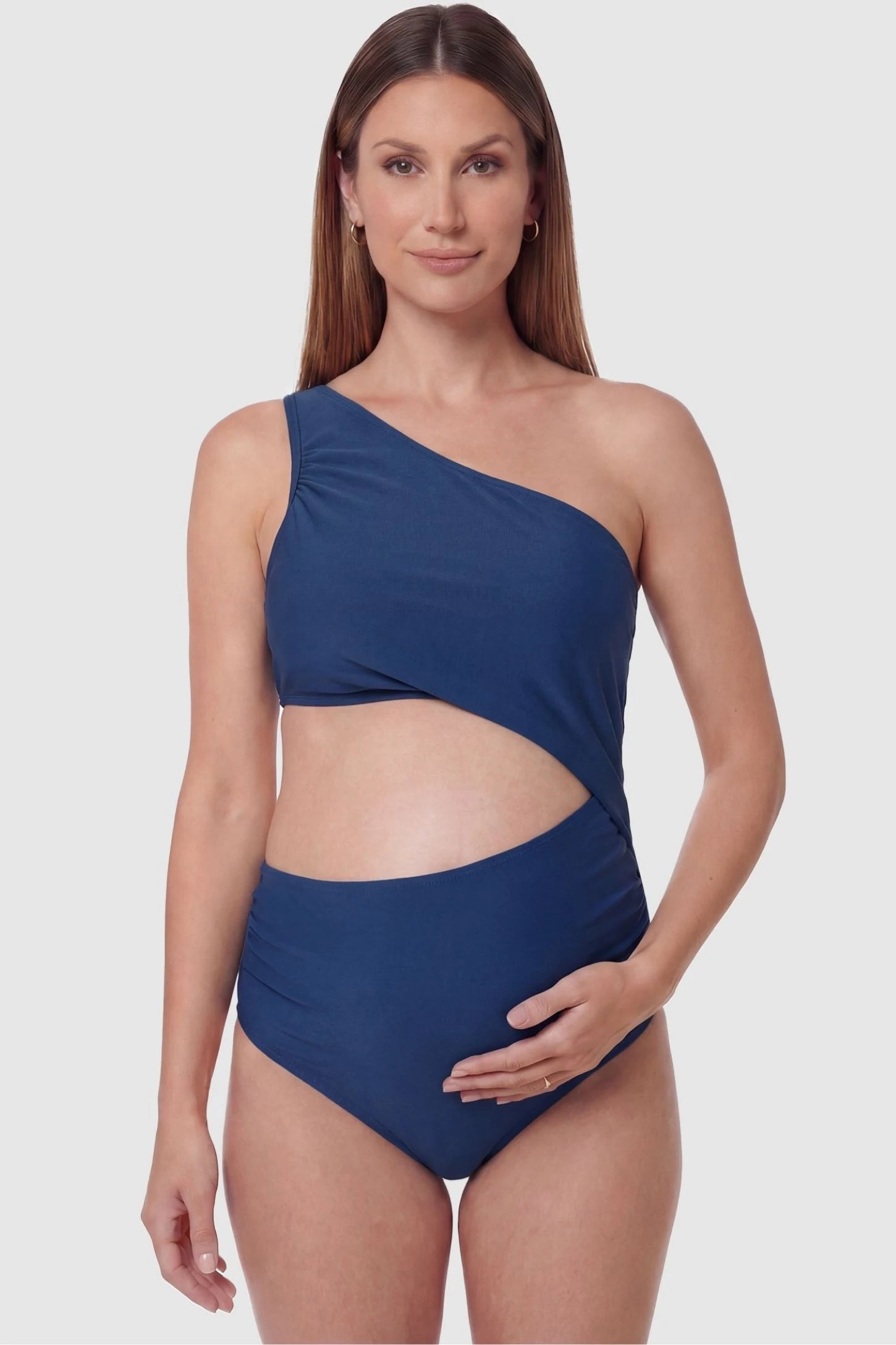 One-Shoulder Cutout Maternity Monokini One-Shoulder Cutout Maternity Monokini in Blue featuring a bold waist cutout on a pregnant model, front view.