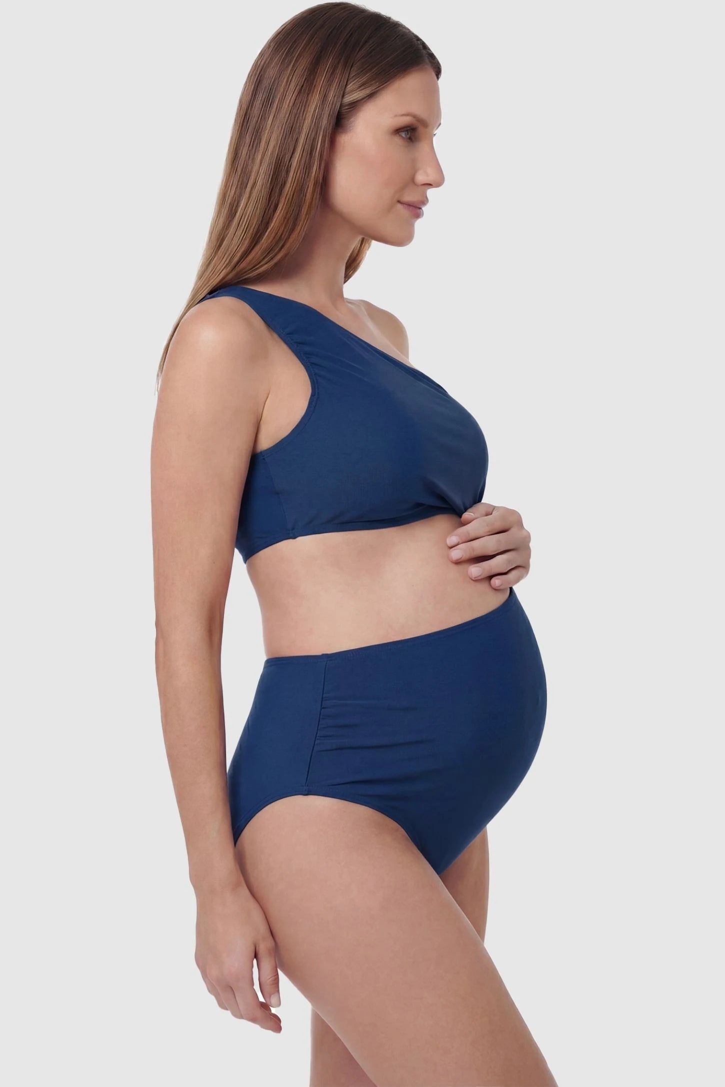 One-Shoulder Cutout Maternity Monokini One-Shoulder Cutout Maternity Monokini in Blue featuring supportive side ruching on a pregnant model, side view.