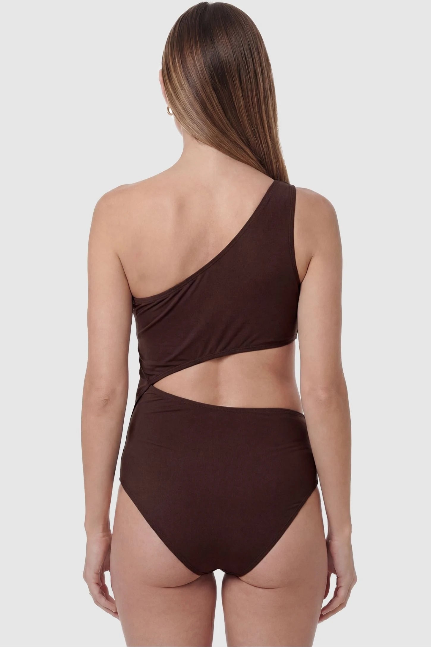 One-Shoulder Cutout Maternity Monokini One-Shoulder Cutout Maternity Monokini in Brown featuring a sculpted back silhouette on a pregnant model, back view.