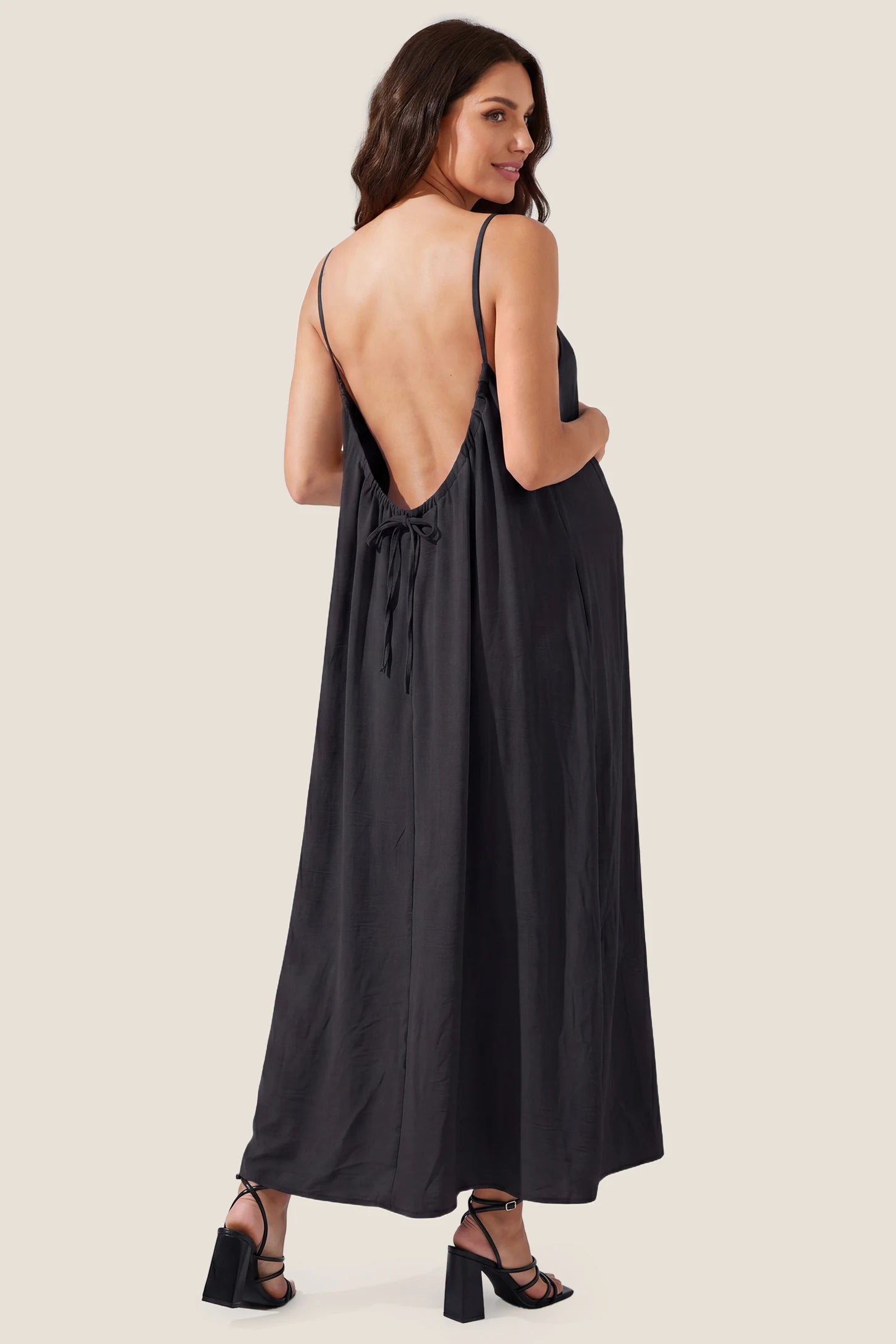 Open Back Flowy Cami Maternity Dress Open Back Flowy Cami Long Maternity Dress in Black showcasing the elegant open back, back view on a pregnant model.