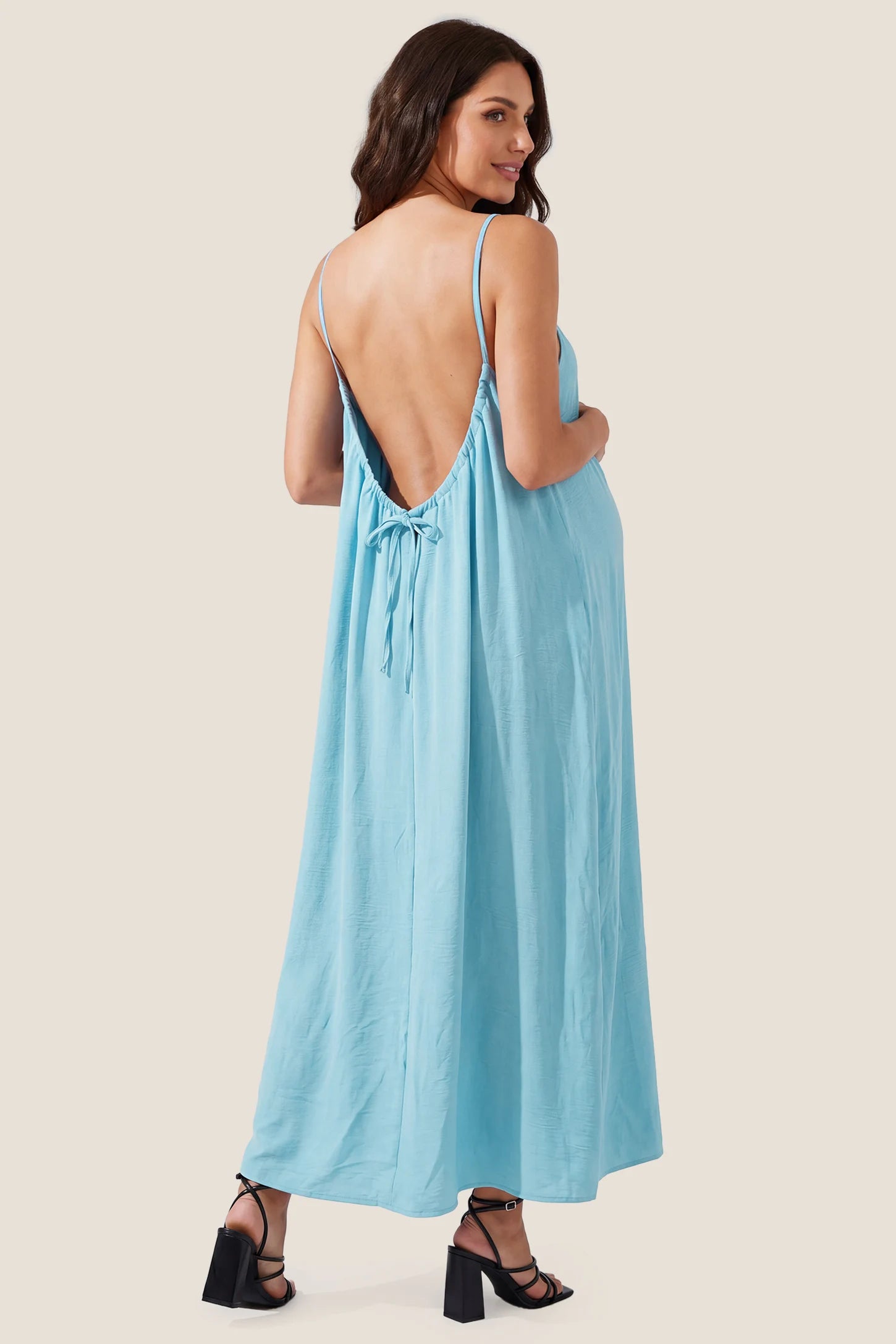 Open Back Flowy Cami Maternity Dress Open Back Flowy Cami Long Maternity Dress in Midnight Blue showcasing the elegant open back, back view on a pregnant model.
