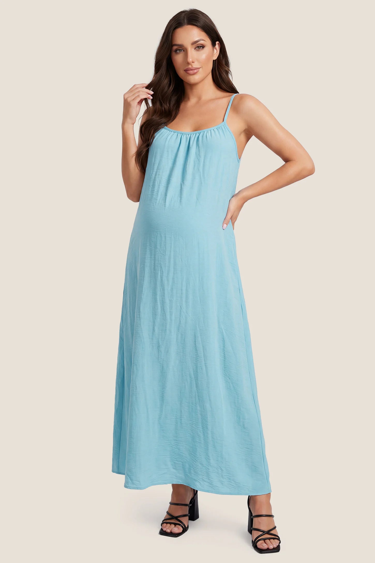 Open Back Flowy Cami Maternity Dress Open Back Flowy Cami Long Maternity Dress in Midnight Blue featuring open back details and flowy cami straps, front view on a pregnant model.