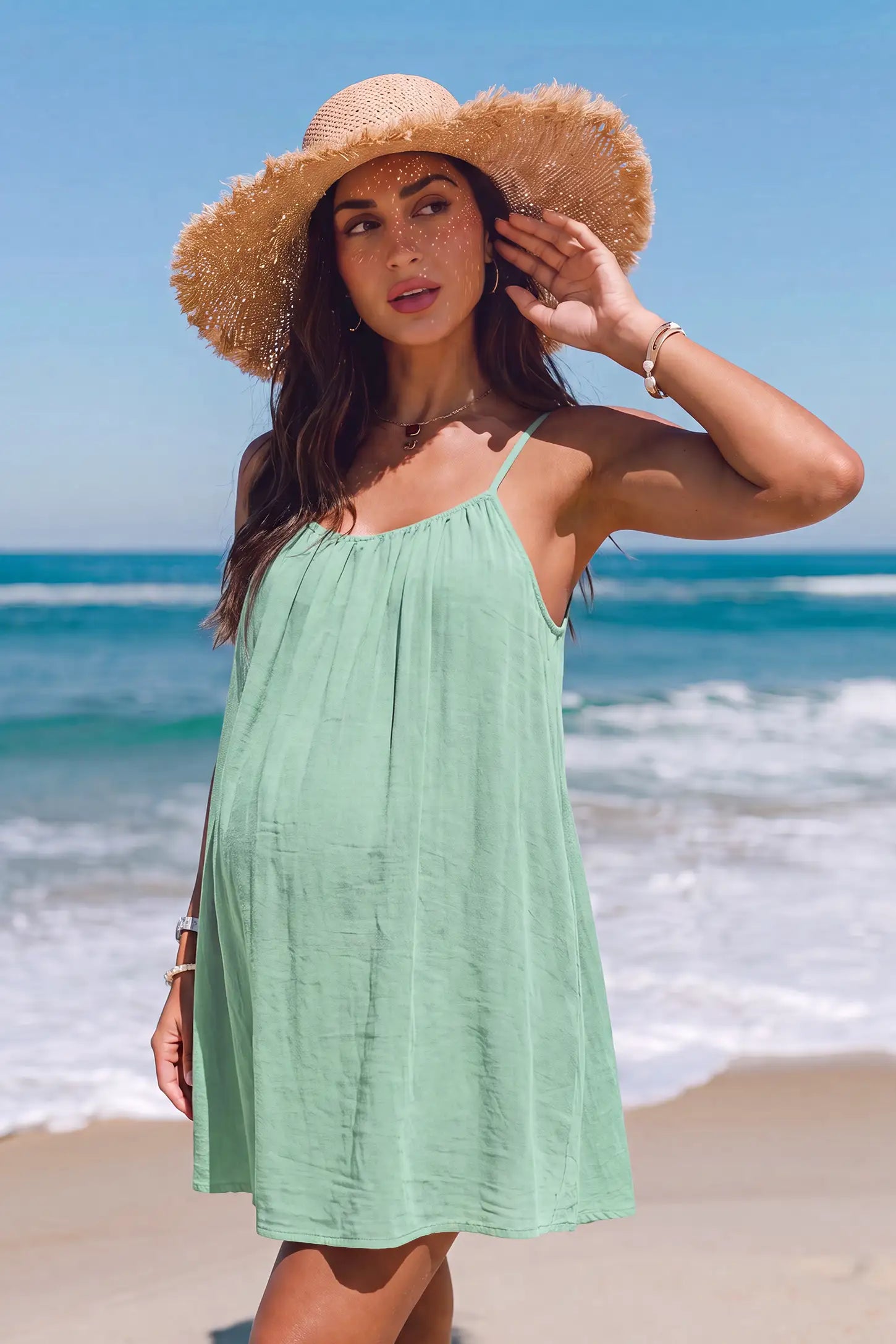 Open Back Flowy Cami Maternity Dress Open Back Flowy Cami Short Maternity Dress in Military Green with an open back design, lifestyle view on a pregnant model.