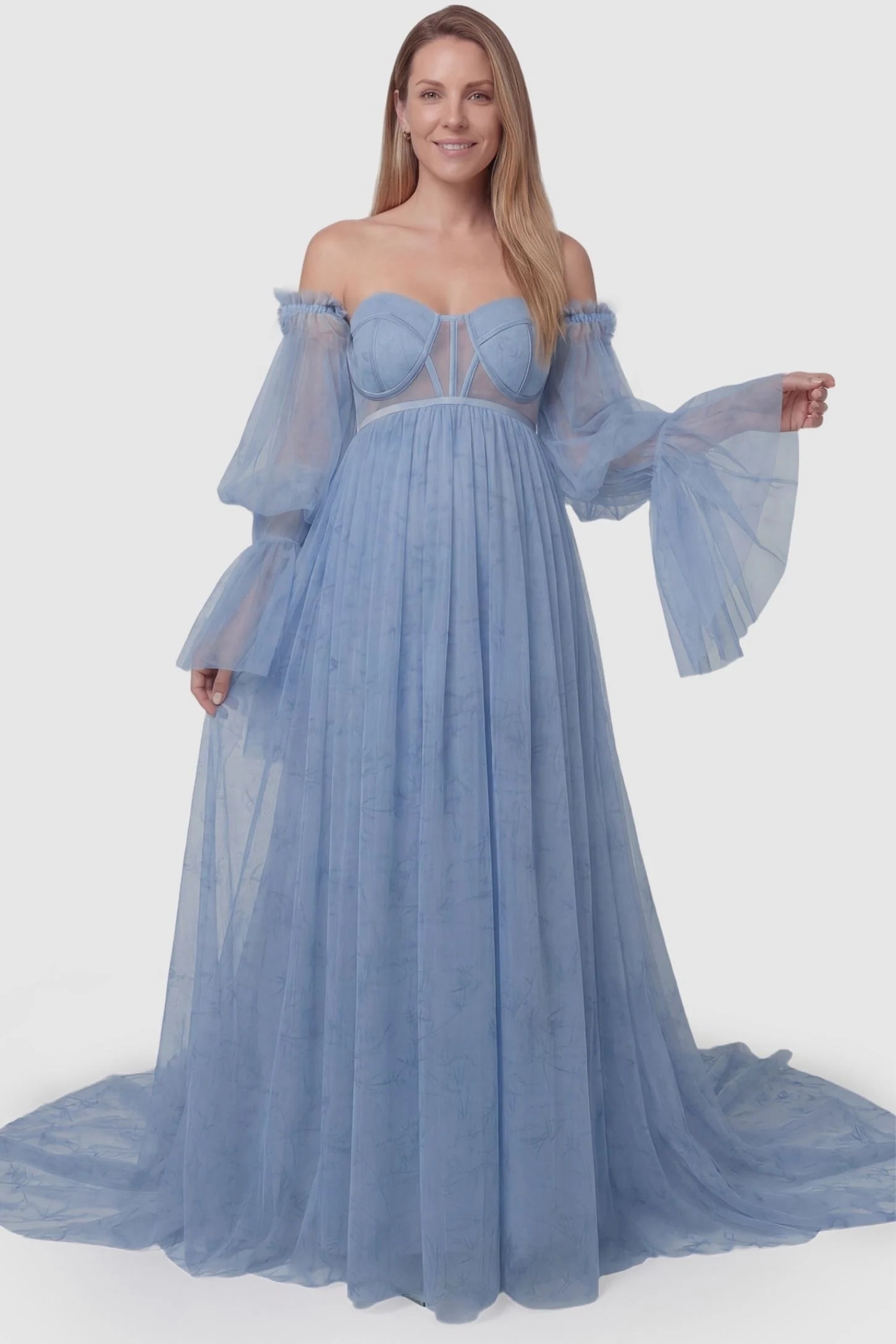 Organza Tie-Back Off-Shoulder Long Sleeve Maternity Gown Organza Tie-Back Off-Shoulder Maternity Gown in Blue featuring a flattering empire waist on a non-pregnant model.