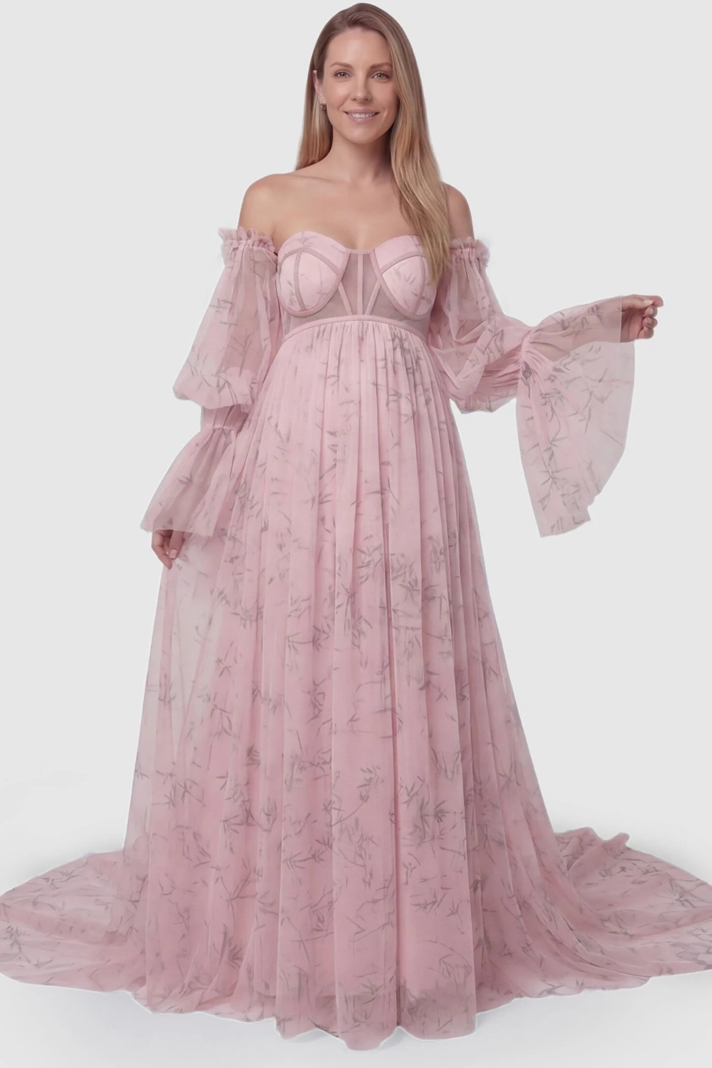 Organza Tie-Back Off-Shoulder Long Sleeve Maternity Gown Organza Tie-Back Off-Shoulder Maternity Gown in Pink featuring a flexible empire waist on a non-pregnant model.