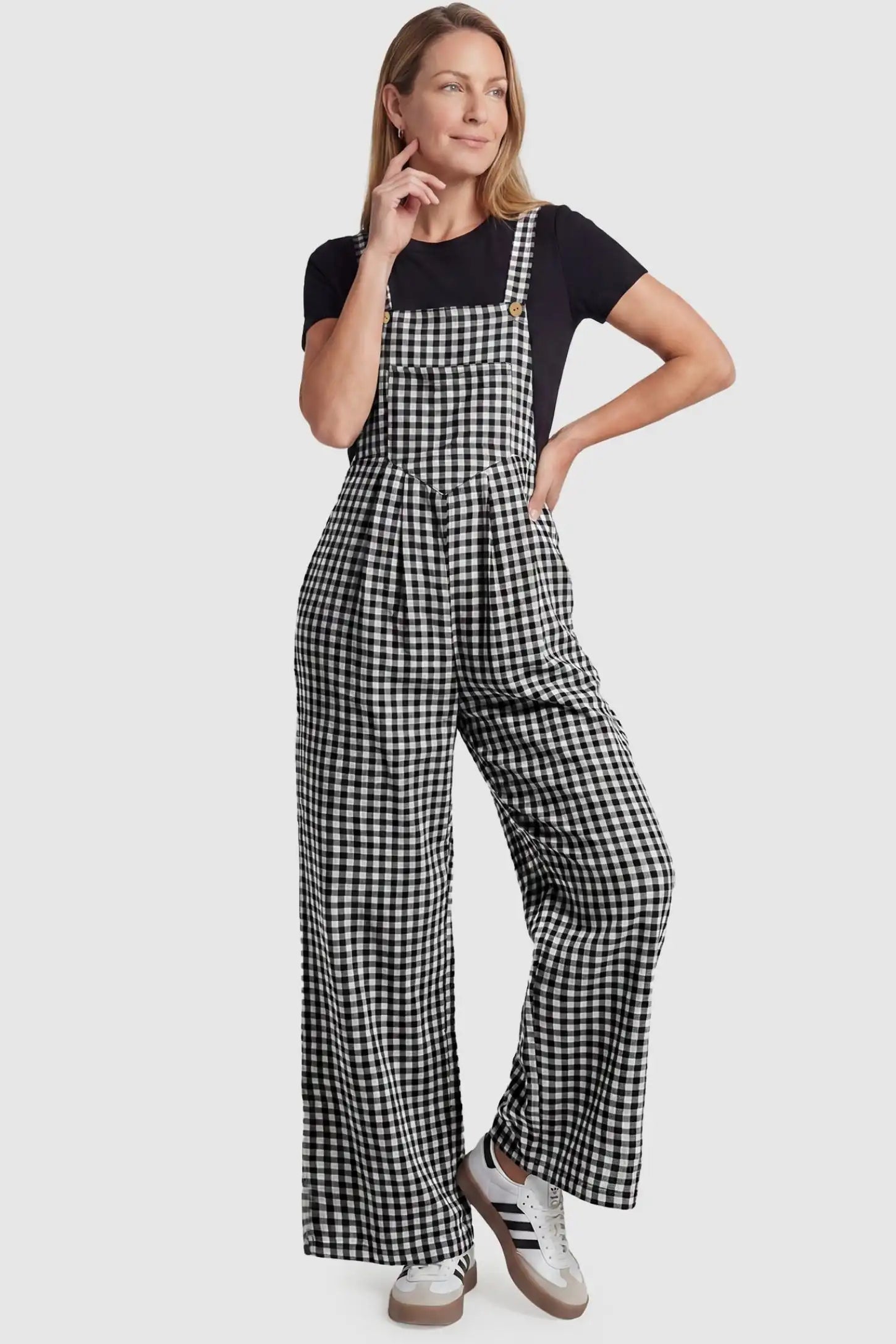 Plaid Square-Neck Button-Detail Maternity Jumpsuit Plaid Square-Neck Button-Detail Maternity Jumpsuit in Black featuring a relaxed silhouette on a non-pregnant model in a front view.