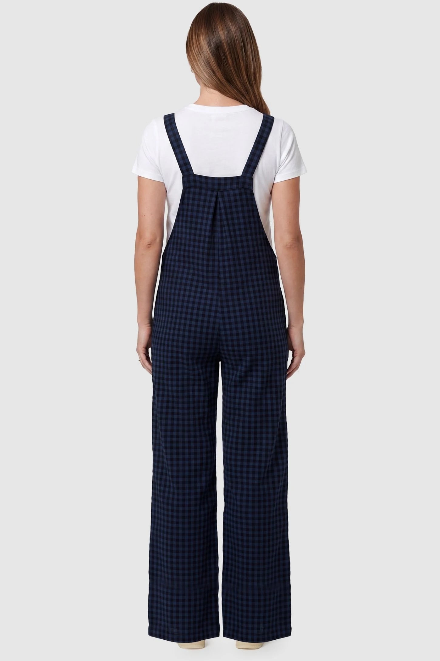 Plaid Square-Neck Button-Detail Maternity Jumpsuit Plaid Square-Neck Button-Detail Maternity Jumpsuit in Blue featuring wide-leg trousers on a pregnant model in a back view.