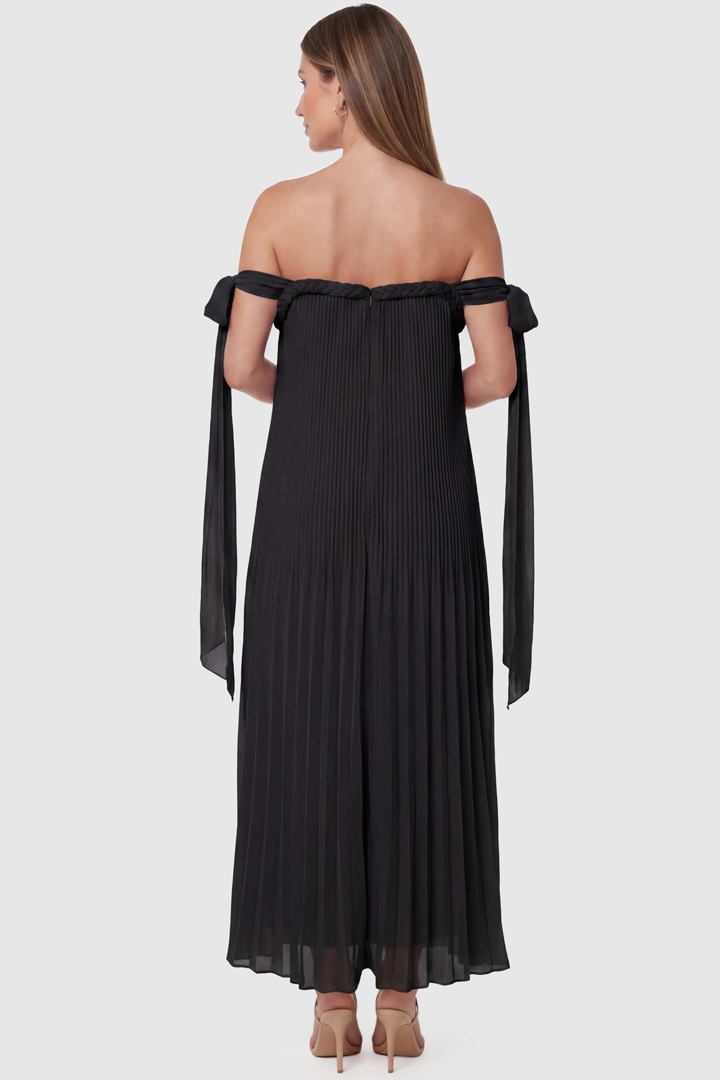 Pleated Braided Cold-Shoulder Maxi Maternity Gown Pleated Braided Cold-Shoulder Maxi Maternity Gown in Black featuring a braided back neckline detail on a pregnant model, back view.