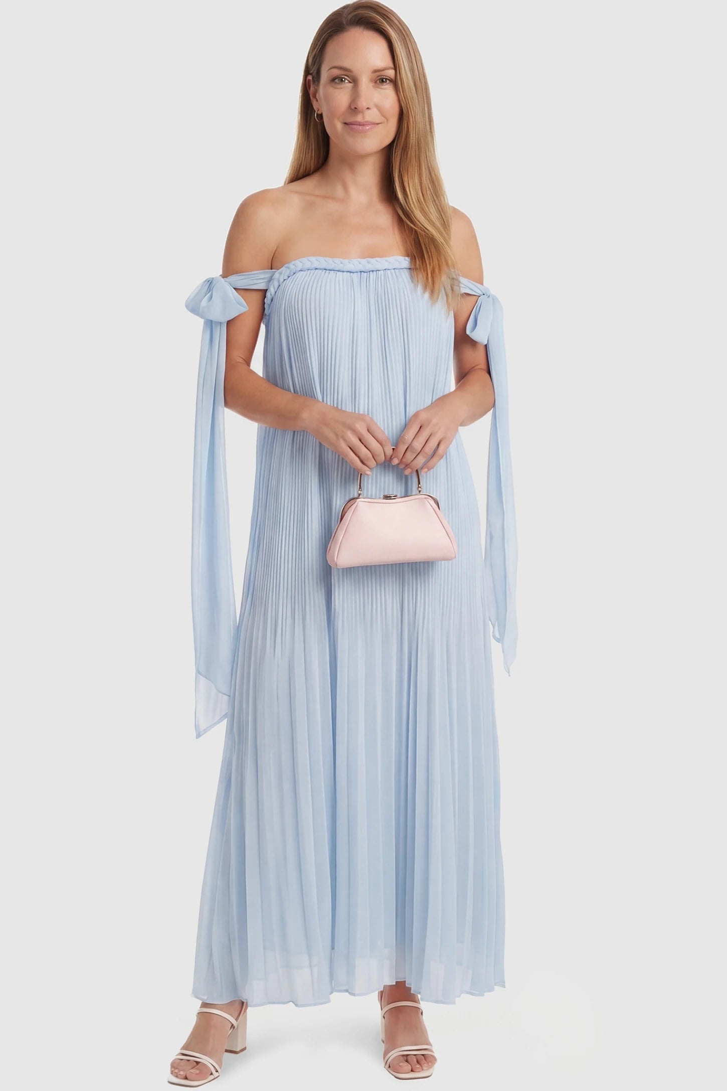 Pleated Braided Cold-Shoulder Maxi Maternity Gown Pleated Braided Cold-Shoulder Maxi Maternity Gown in Blue featuring a flowy silhouette on a non-pregnant model, postpartum view.