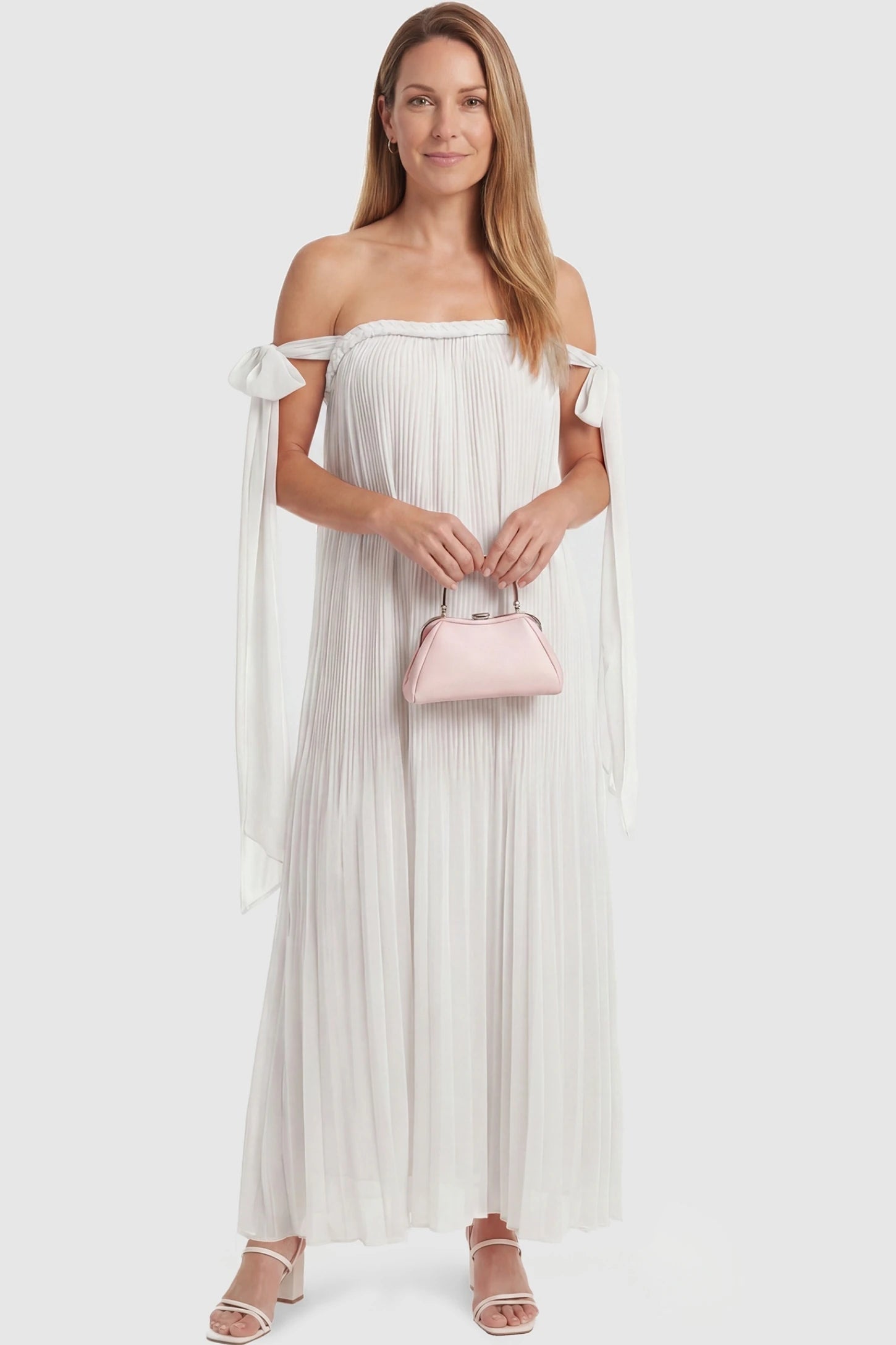 Pleated Braided Cold-Shoulder Maxi Maternity Gown Pleated Braided Cold-Shoulder Maxi Maternity Gown in White featuring a flowy silhouette on a non-pregnant model, postpartum view.