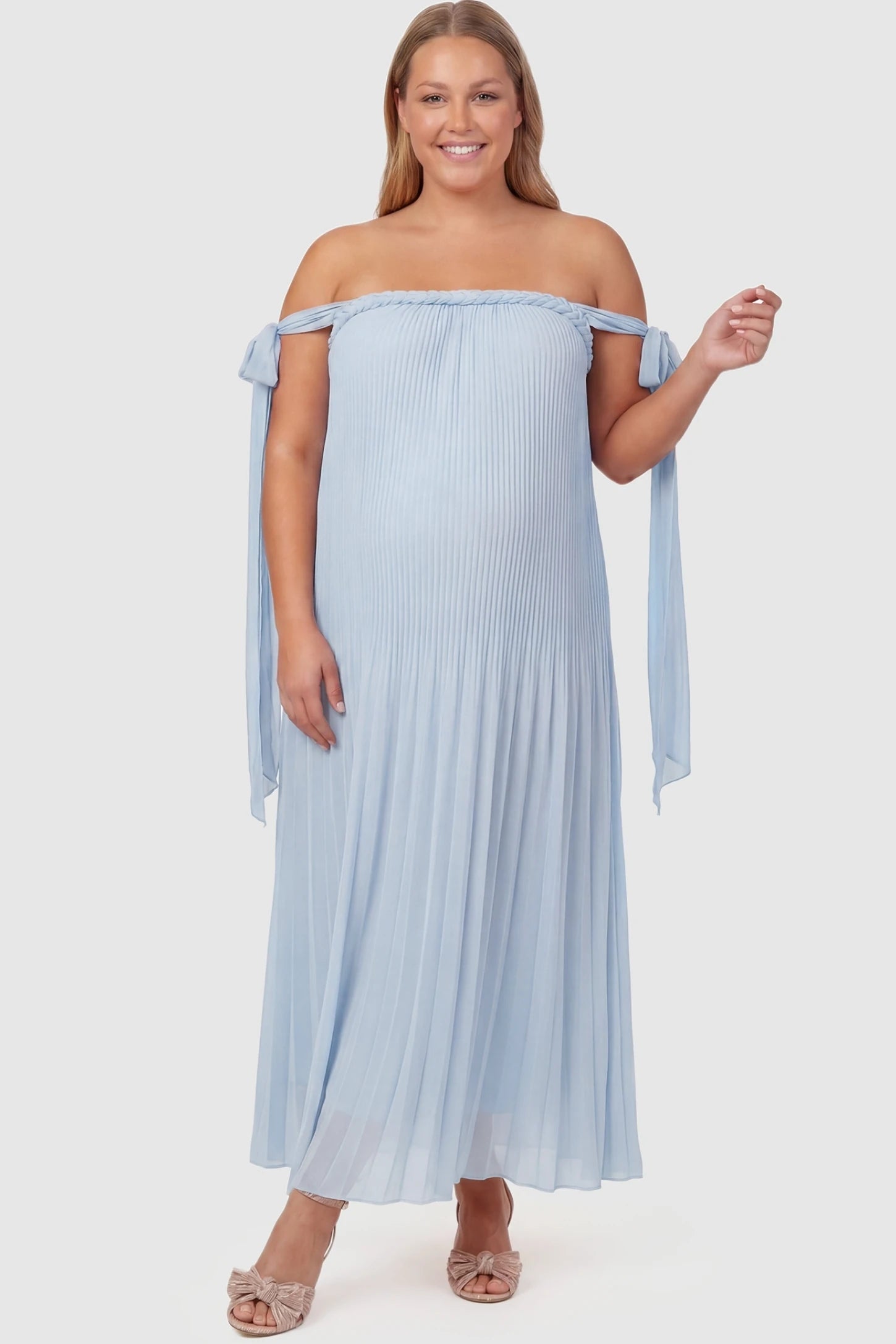 Pleated Braided Cold-Shoulder Maxi Maternity Gown Pleated Braided Cold-Shoulder Maxi Maternity Gown in Blue featuring a braided neckline on a plus-size pregnant model, front view.