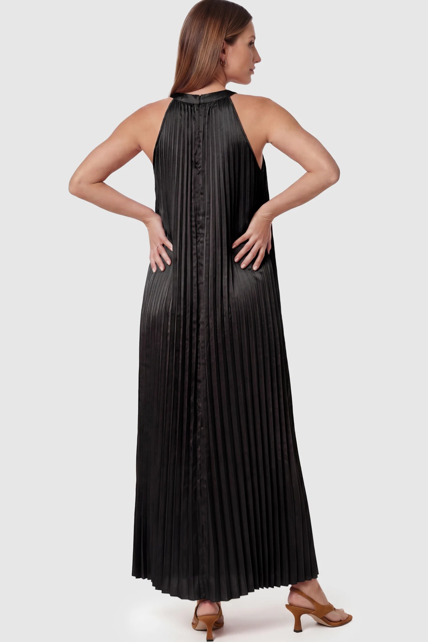 Pleated Faux Silk Halter Maternity Maxi Dress Pleated Faux Silk Halter Maternity Maxi Dress in Black featuring micro-pleat texture on a pregnant model showing back view.