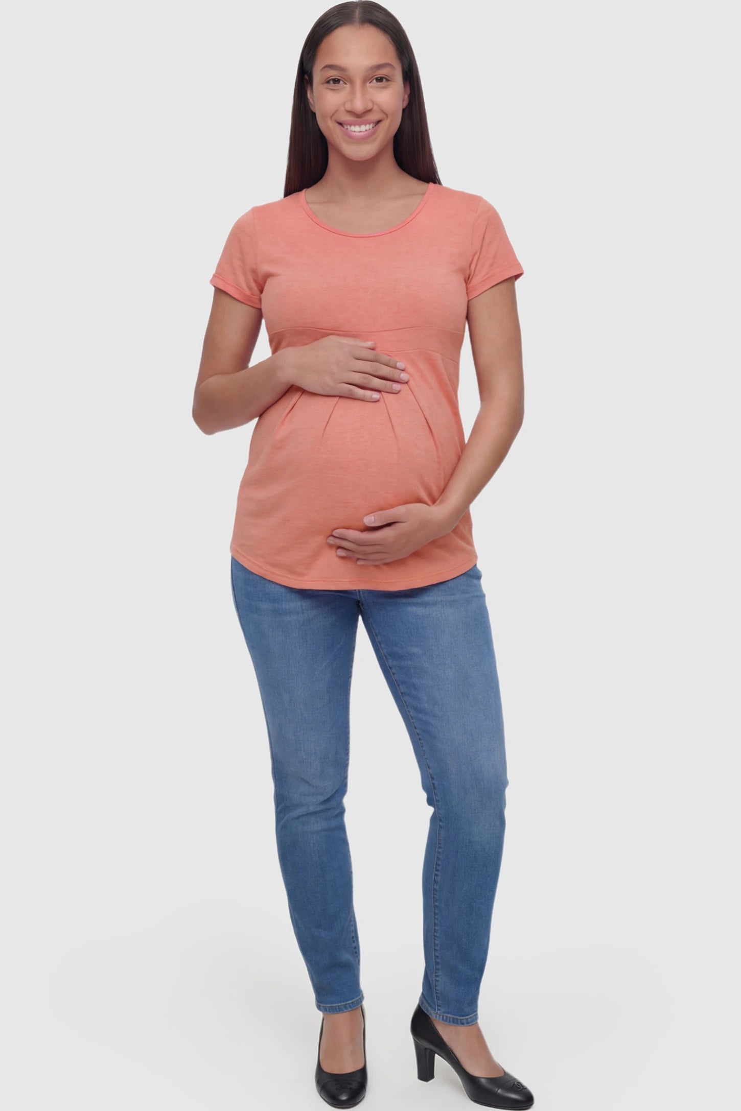 Pleated Heathered Short Sleeve Maternity Top Pleated Heathered Short Sleeve Maternity Top in pink featuring high stretch and breathable fabric on a pregnant model showing full body.